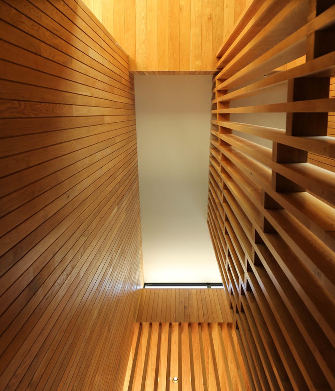 Looking up the 5m-high American oak timber staircase.