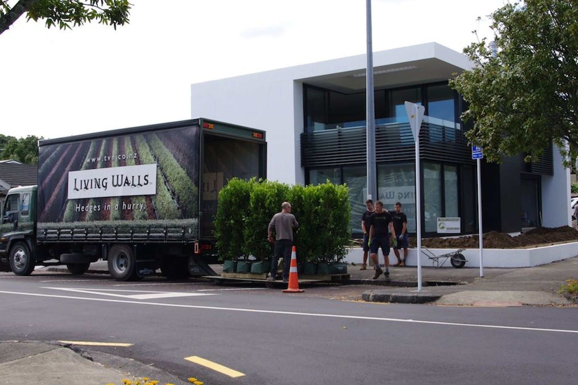 Landscapers on site and instant hedges delivered - ready to transform this newly built house into a home.