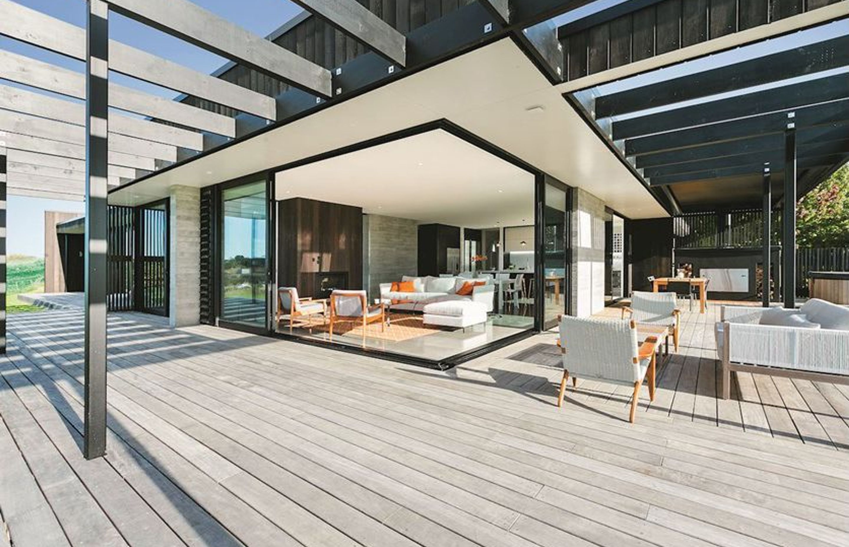 Huge stacker sliders ease the transition between refined interiors and extensive decking.