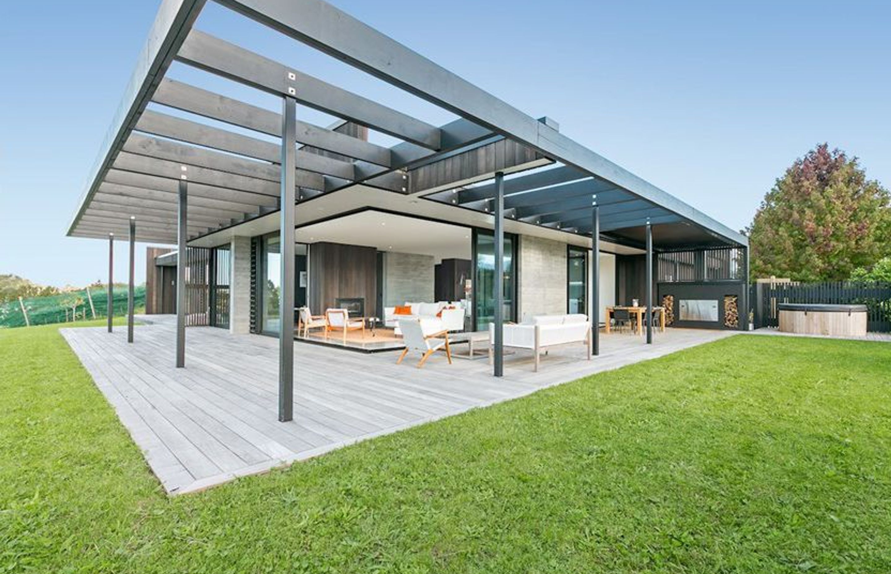 A high level of technical skill was required in the realisation of this striking home. Cedar cladding and Timber-grain, in situ board-form concrete walls marry these materials perfectly.