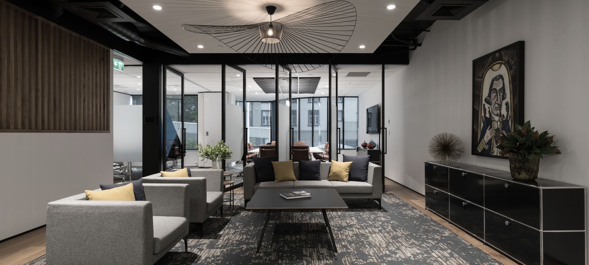 Reception lounge with feature carpet and wood frame flooring, with an operable wall to separate, or join, flexible meeting spaces beyond