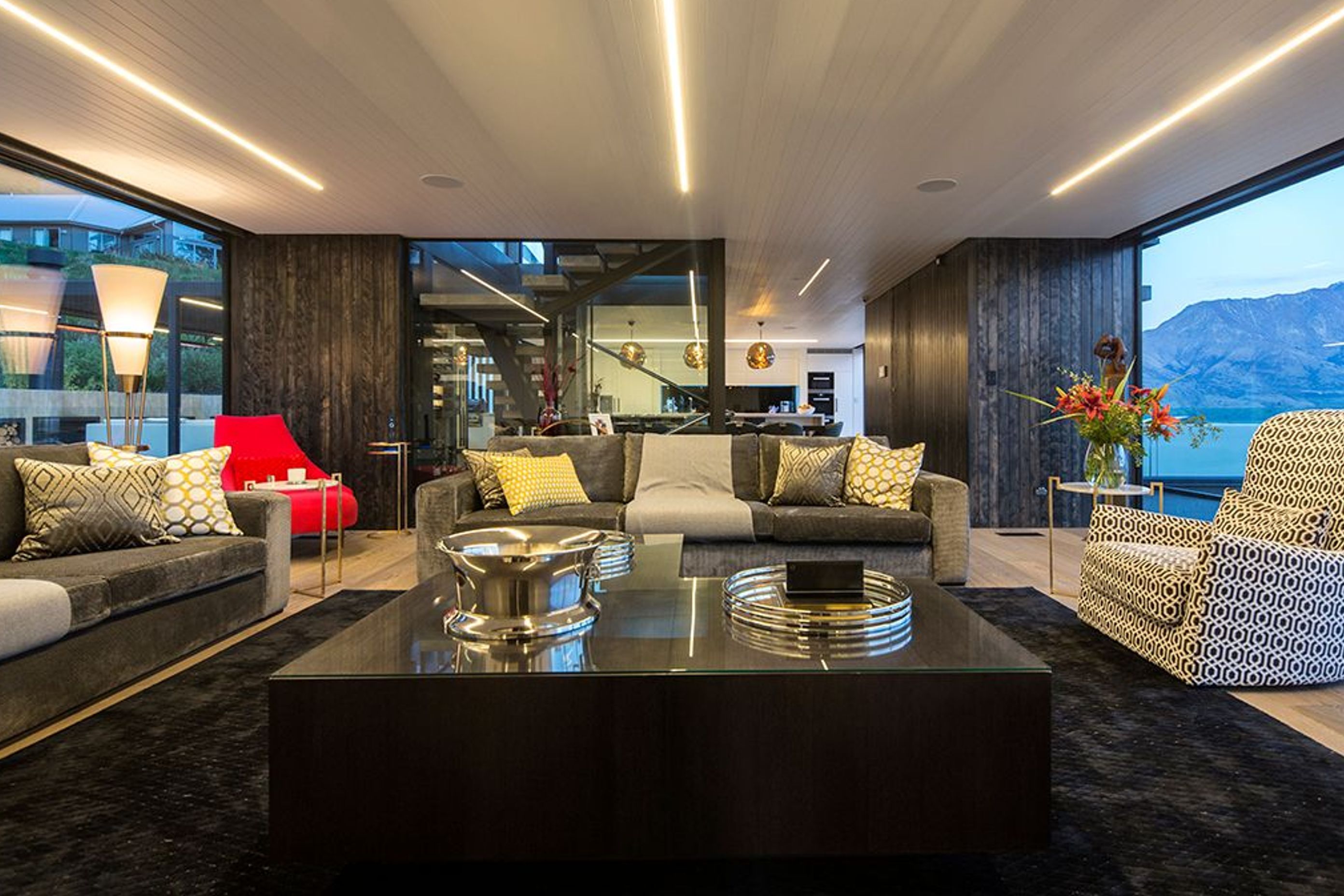 The lounge on the third floor is glazed on either side to maximise the stunning views of the landscape. The design provides a view shaft linking forest to lake and mountains.