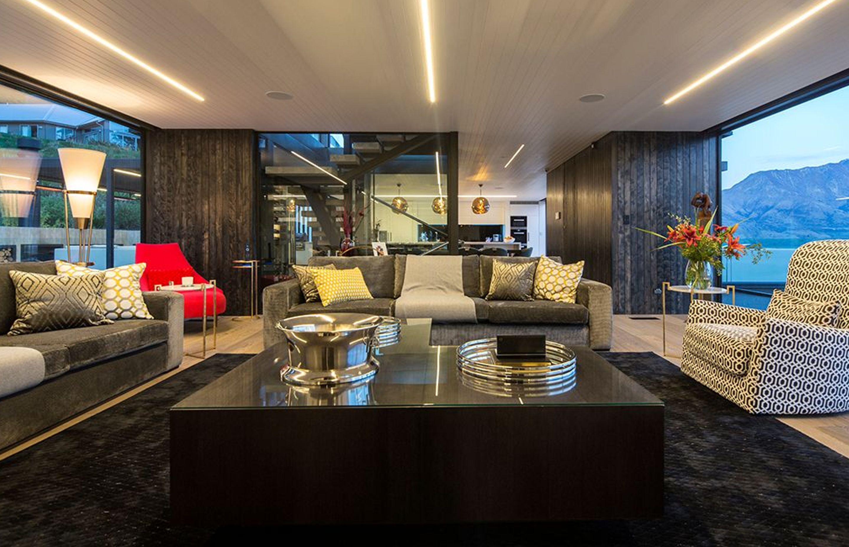 The lounge on the third floor is glazed on either side to maximise the stunning views of the landscape. The design provides a view shaft linking forest to lake and mountains.