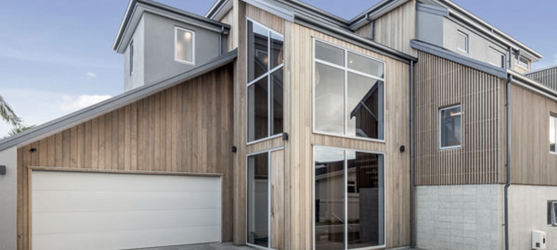 Clad in Cedar timber this Mount Maunganui home sits well in the coastal environment with wonderful water views as the backdrop.