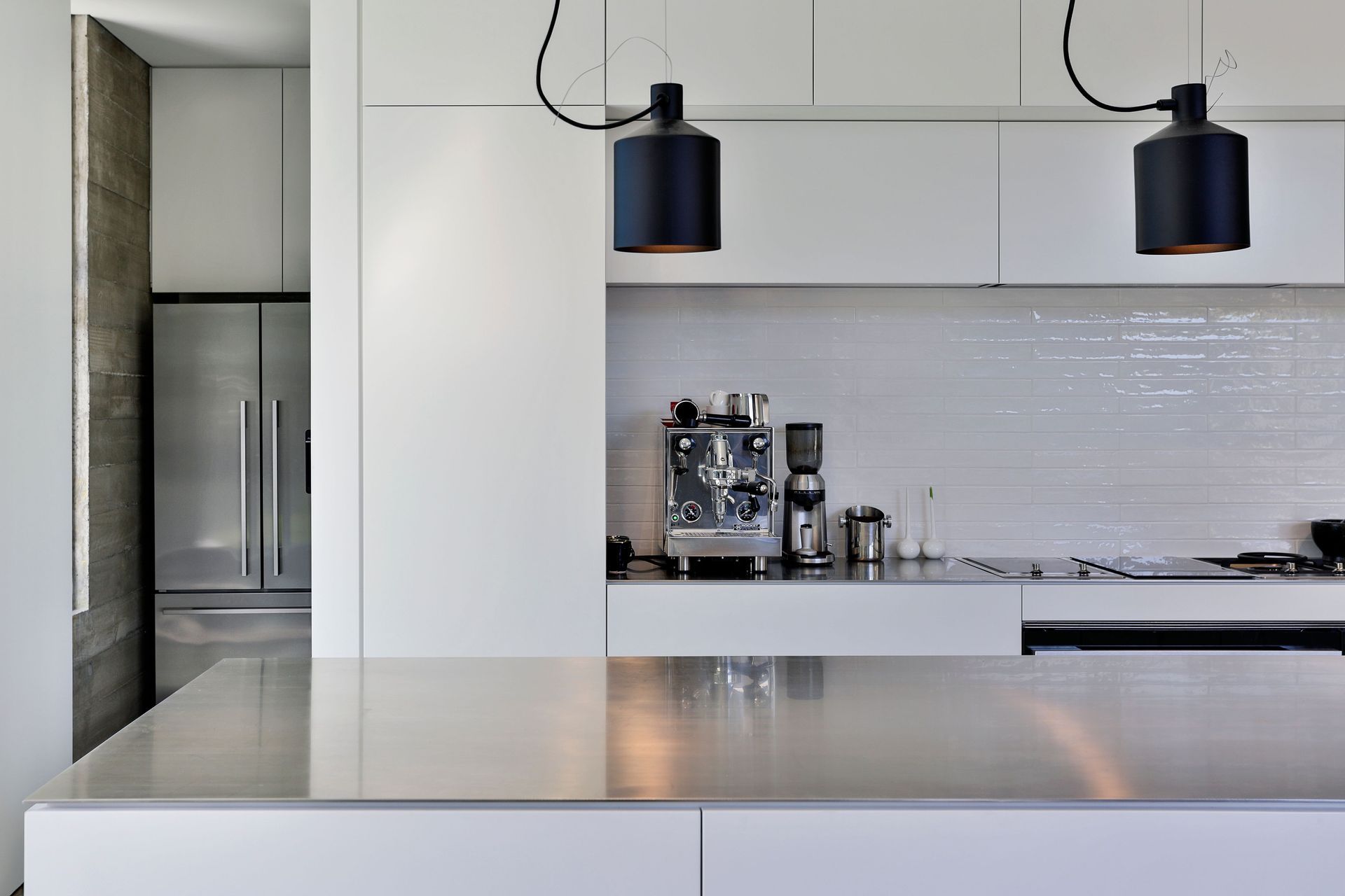 Behind the kitchen is a scullery and laundry with a window view of the garden.