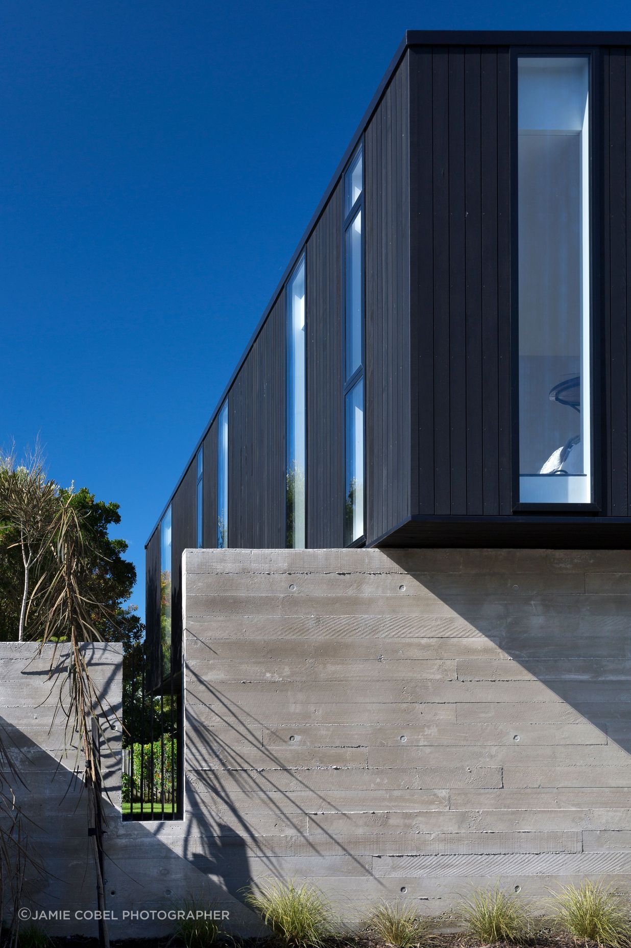Rectangular cut-outs in the concrete walls emulate the penetrations in the upper box.