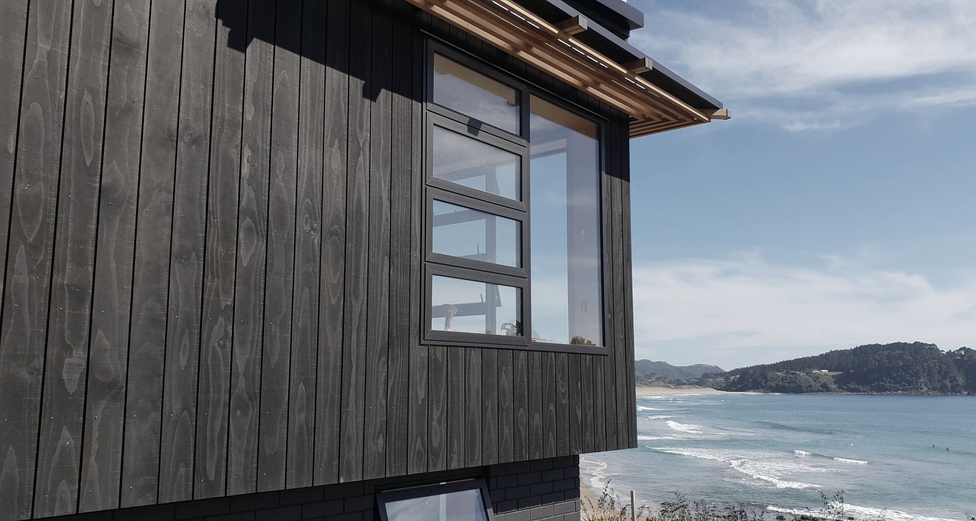 Coromandel House - Accoya stained black banner