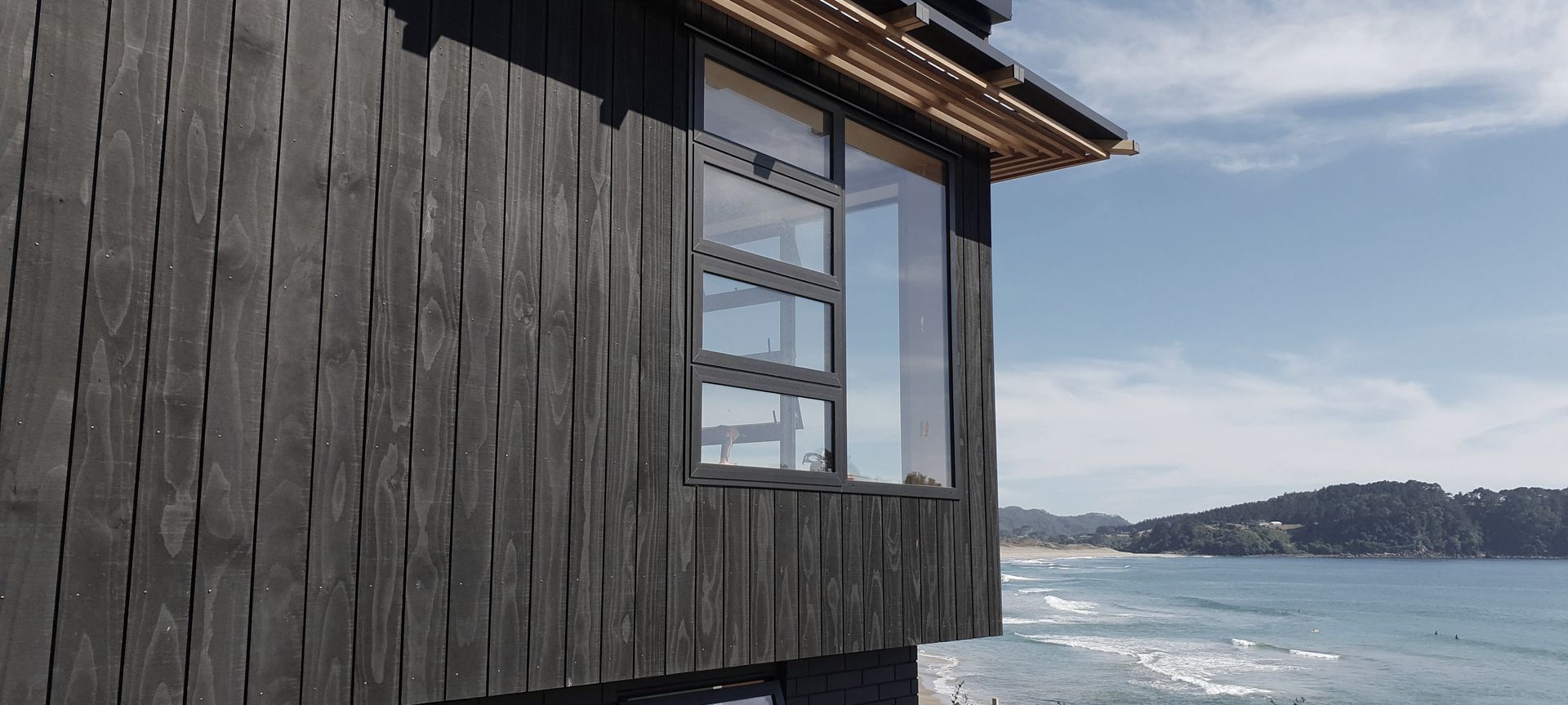 Coromandel House - Accoya stained black banner