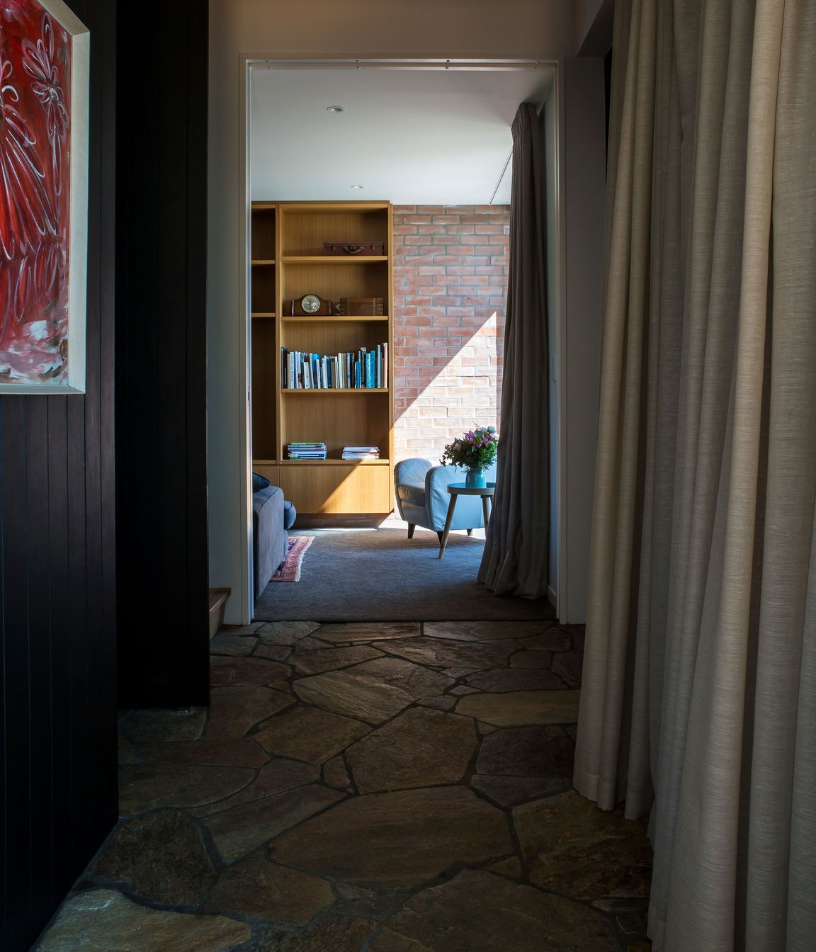 The ground-floor corridor leading to the media room with its crazy paving floor.