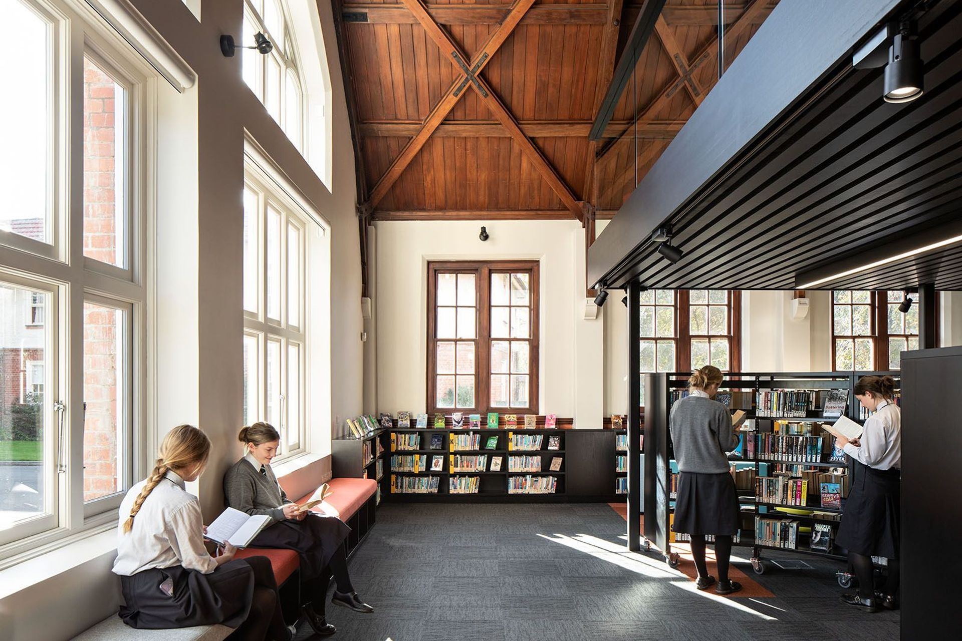 The timber ceilings are a feature of the library, once the original dining hall.