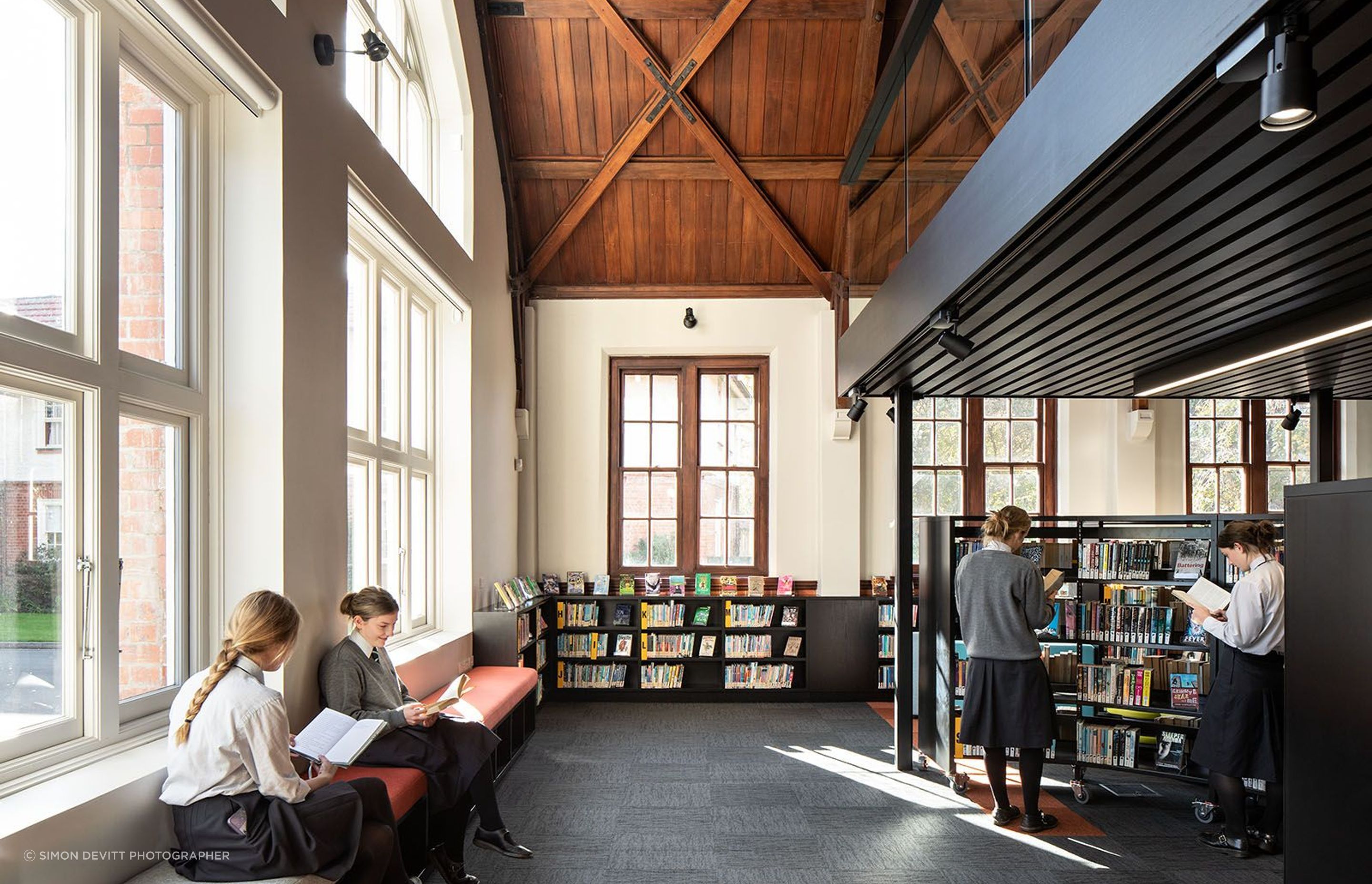 The timber ceilings are a feature of the library, once the original dining hall.