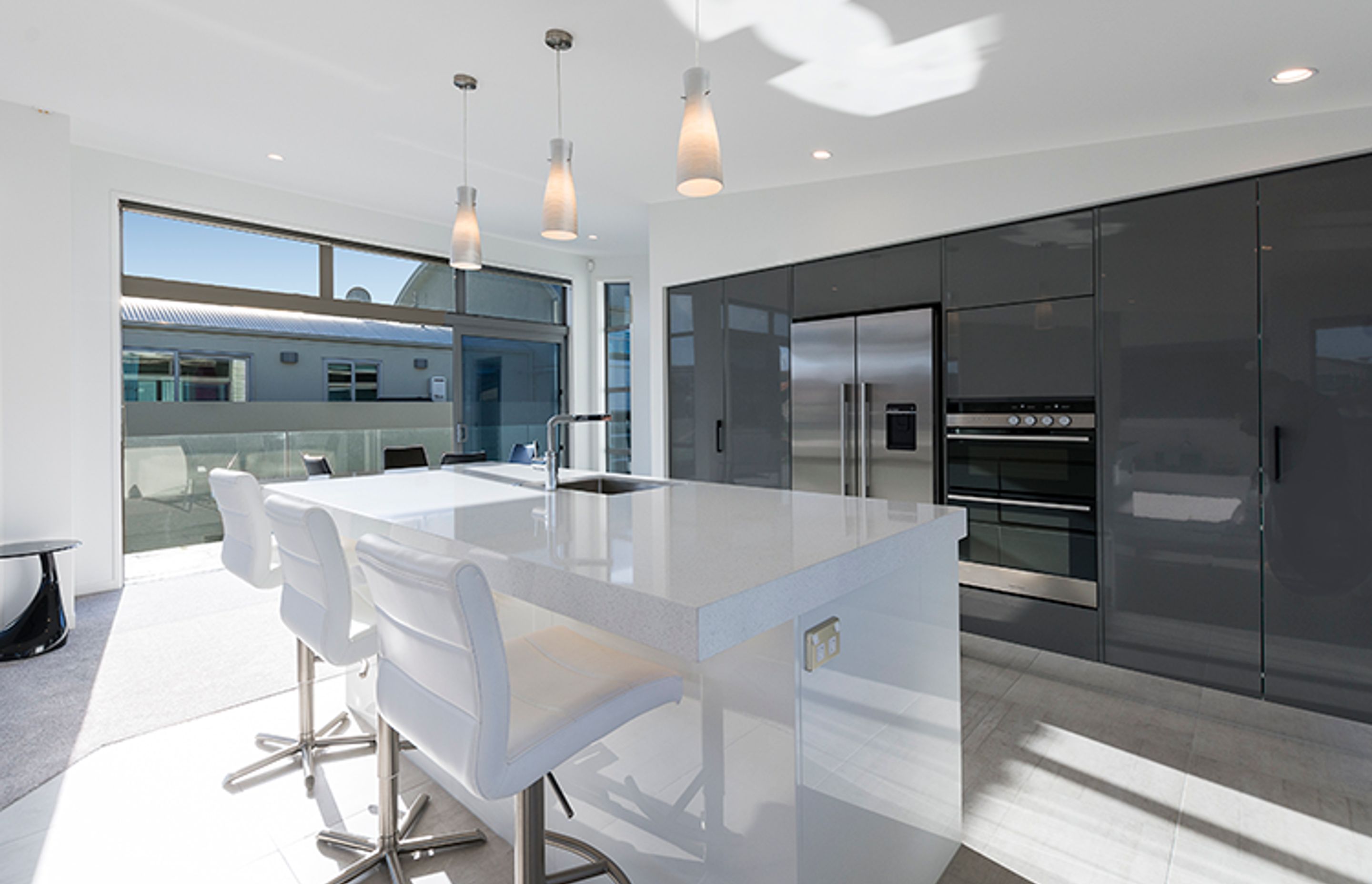 White stone and grey are the perfect combination throughout this contemporary home. 
