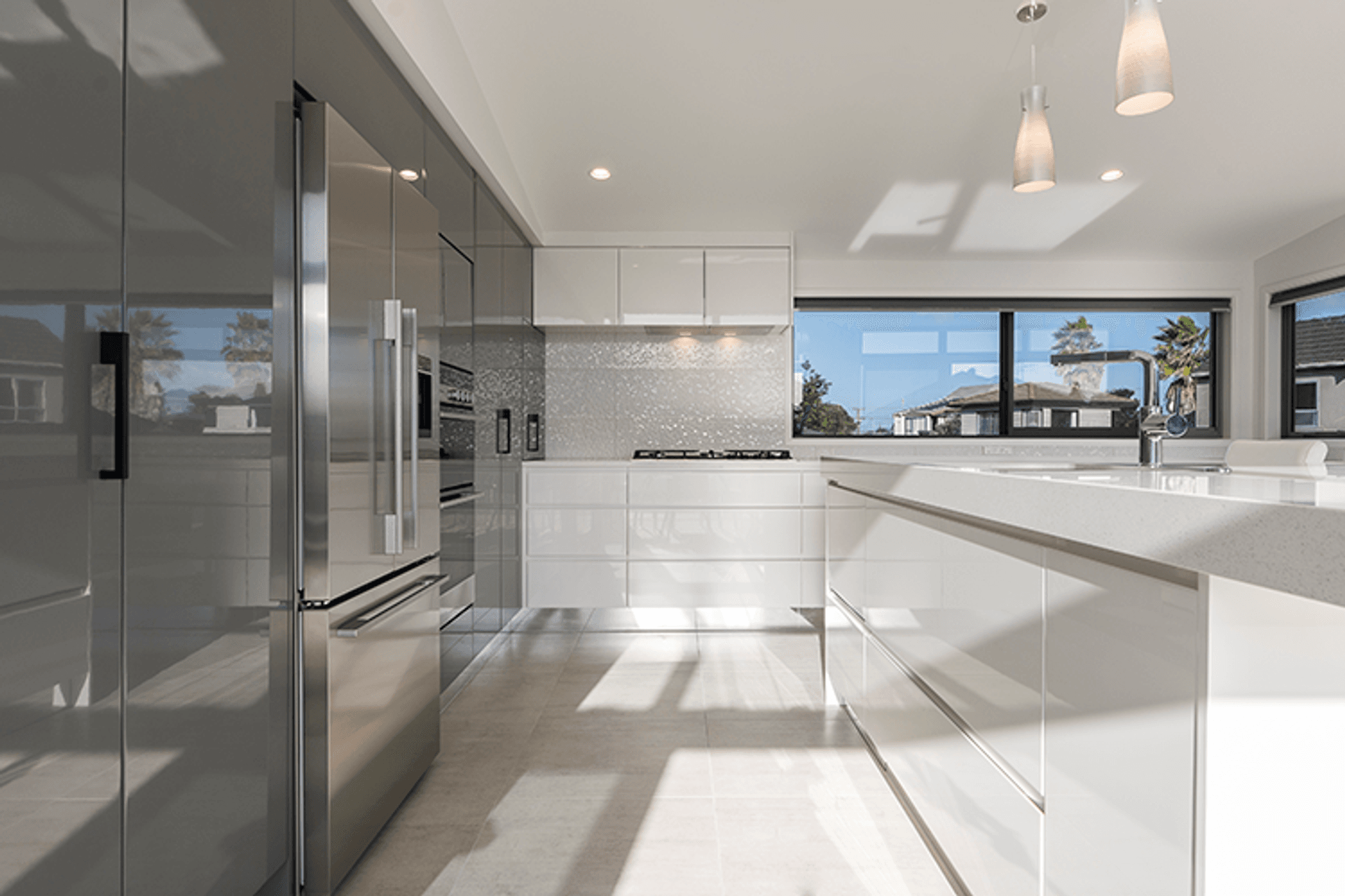 The upper level features open-plan living with a striking kitchen and impressive decking ensuring the home has significant indoor and outdoor flow off the living spaces.