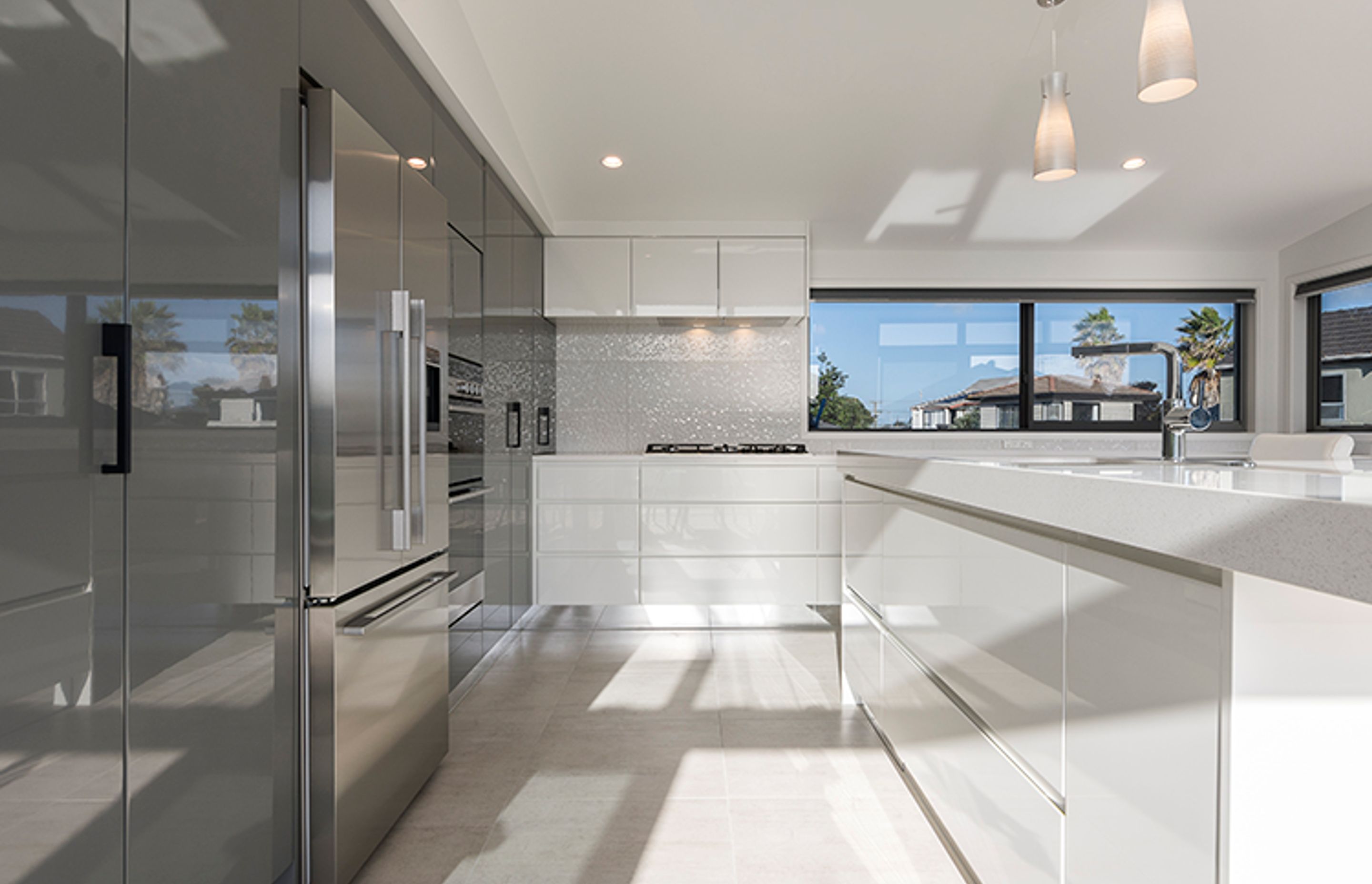 The upper level features open-plan living with a striking kitchen and impressive decking ensuring the home has significant indoor and outdoor flow off the living spaces.