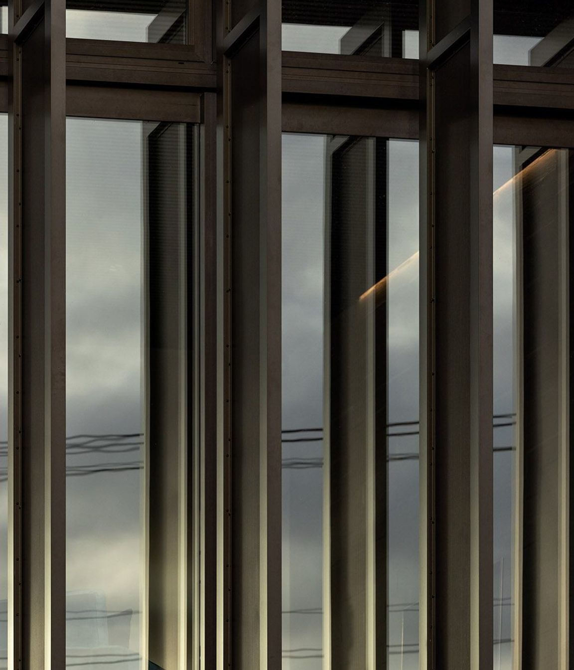 Perforated aluminium screens allow for differing levels of light to be achieved