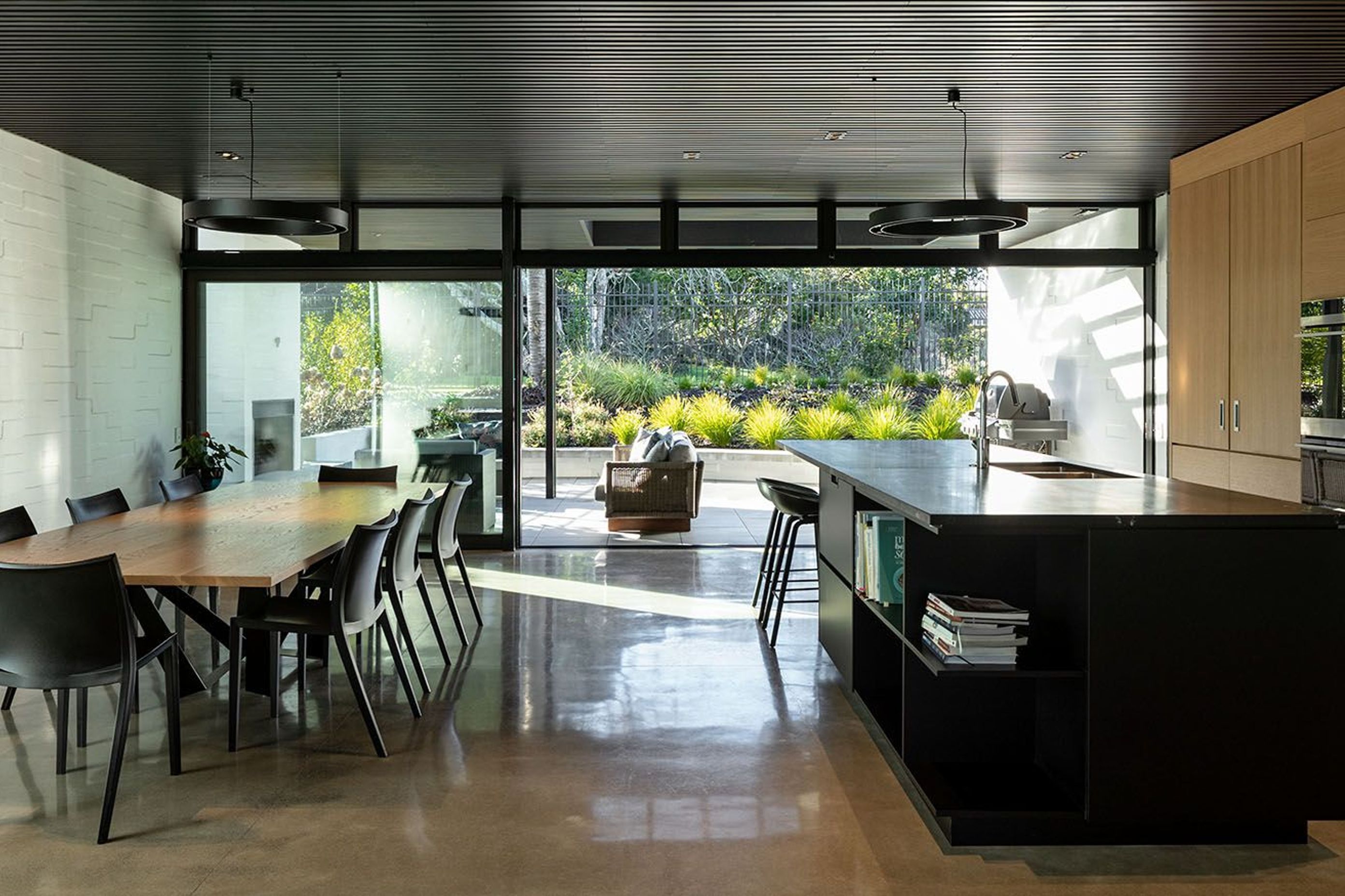 The rear entertaining courtyard draws on a close link to the adjoining park and its mature trees.
