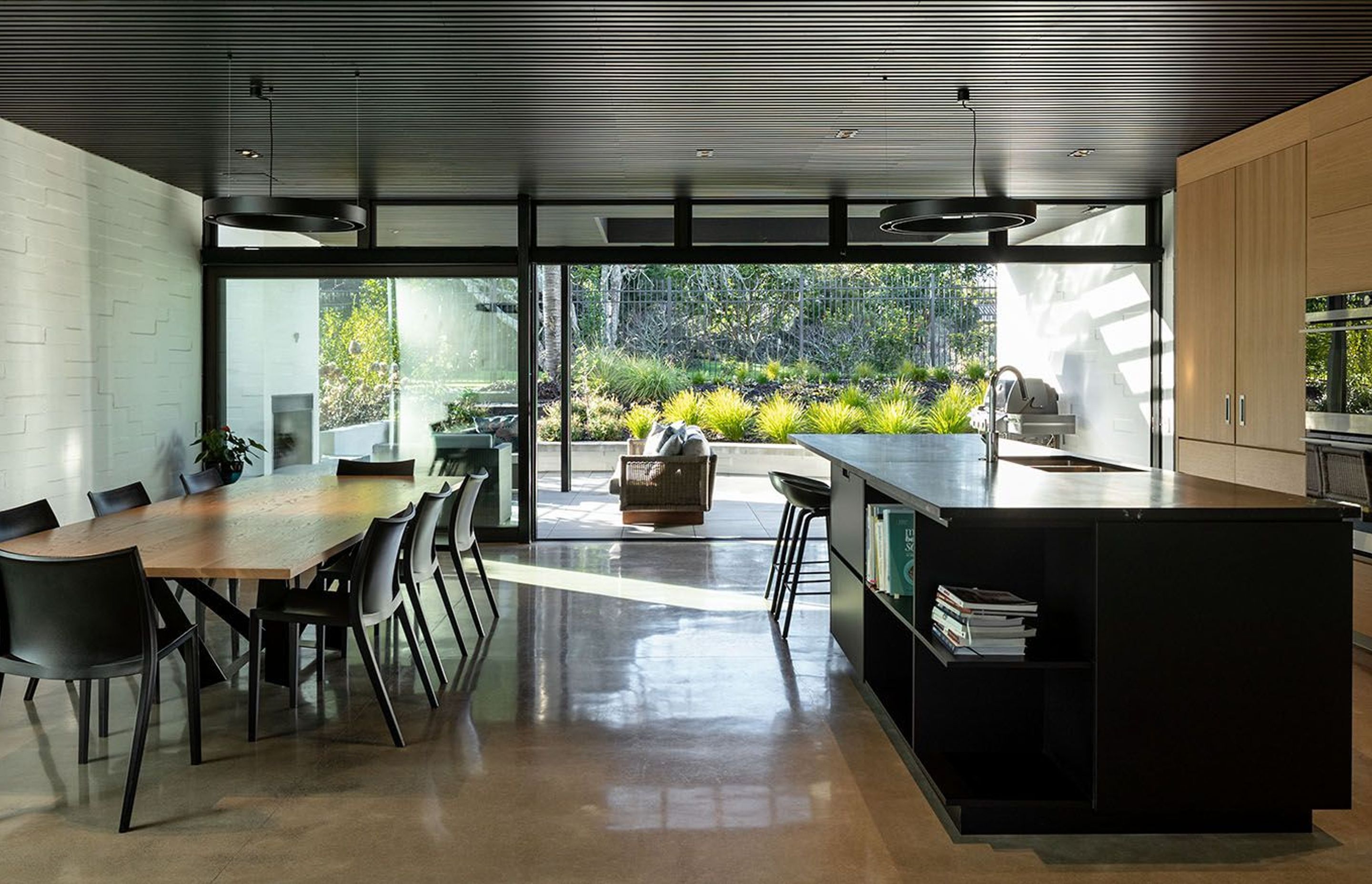 The rear entertaining courtyard draws on a close link to the adjoining park and its mature trees.