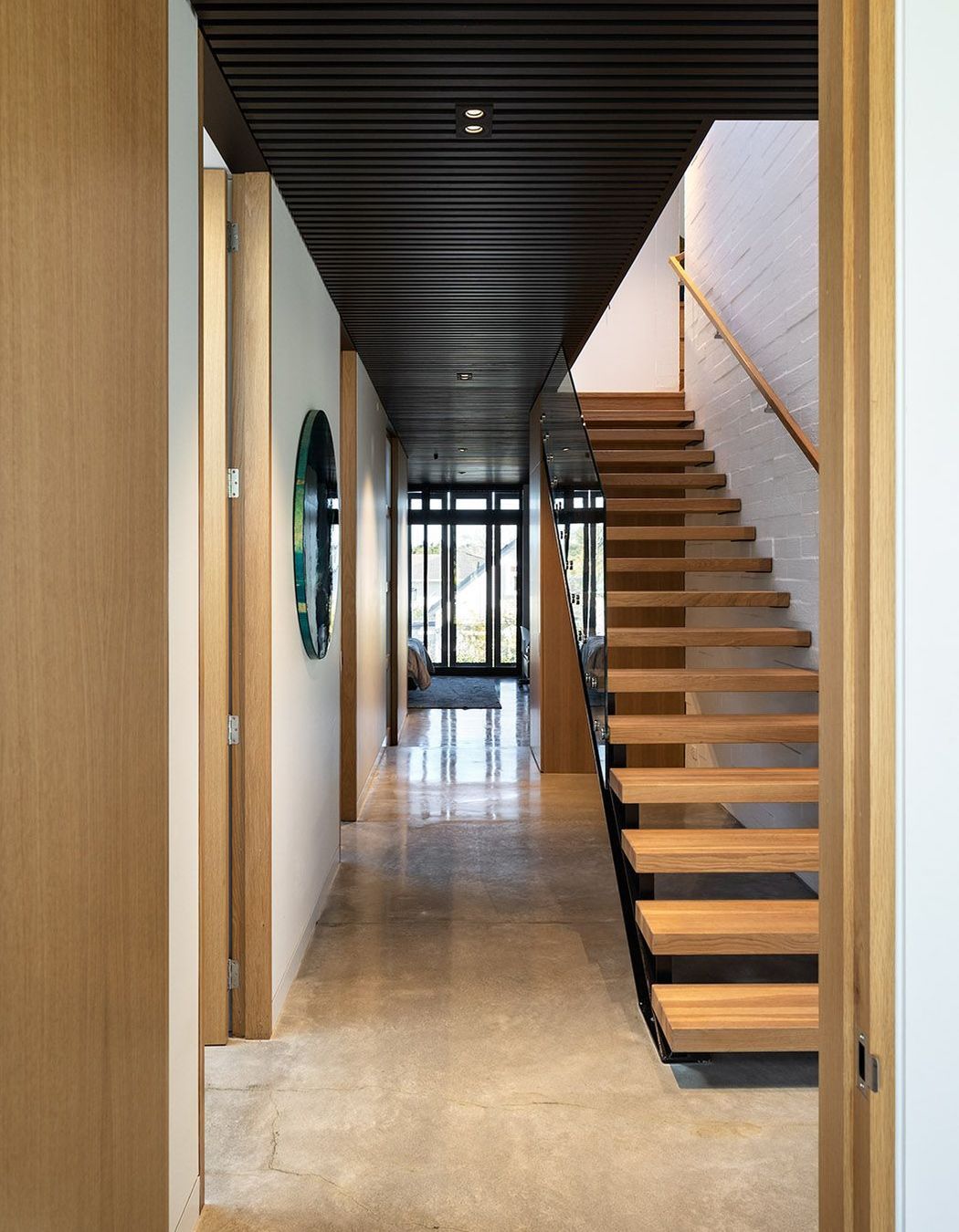 The bagged concrete block continues seamlessly between exterior and interior.