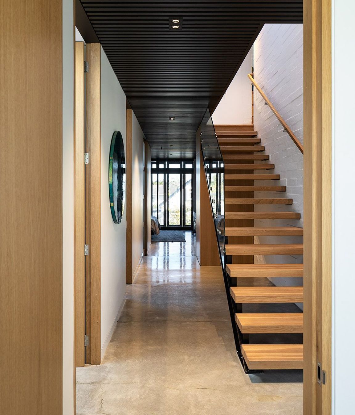 The bagged concrete block continues seamlessly between exterior and interior.