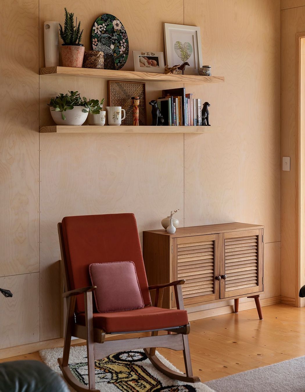 Plywood lines the interior spaces, providing a warm backdrop for vintage furntiture.