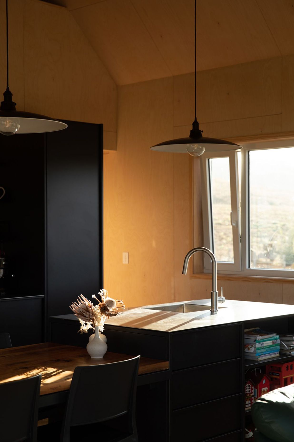 The stainless steel benchtop is a durable low-maintenance work surface in the kitchen.