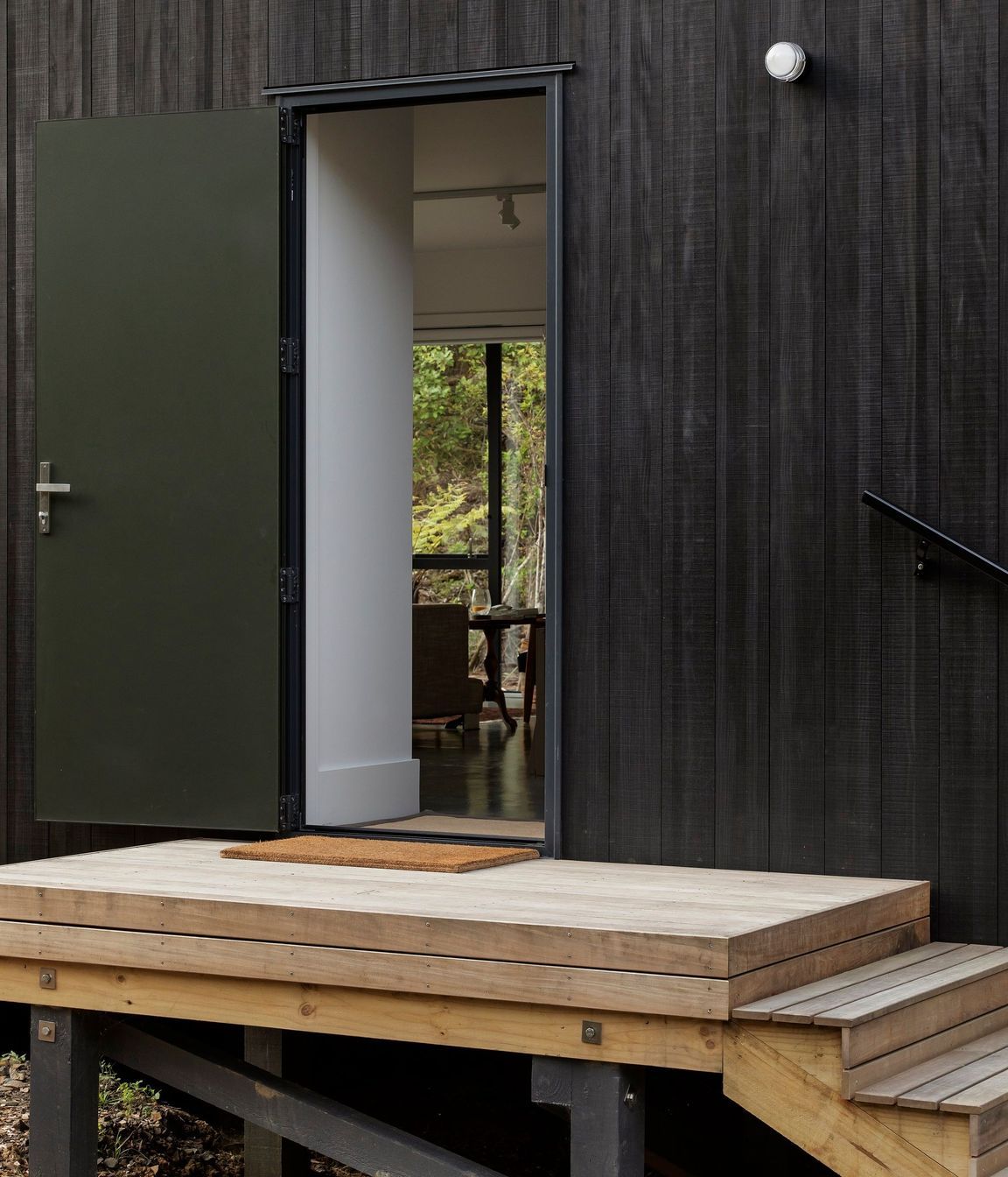 Stairs lead up to the main entrance, from which a choice is offered between the public and private parts of the home. 