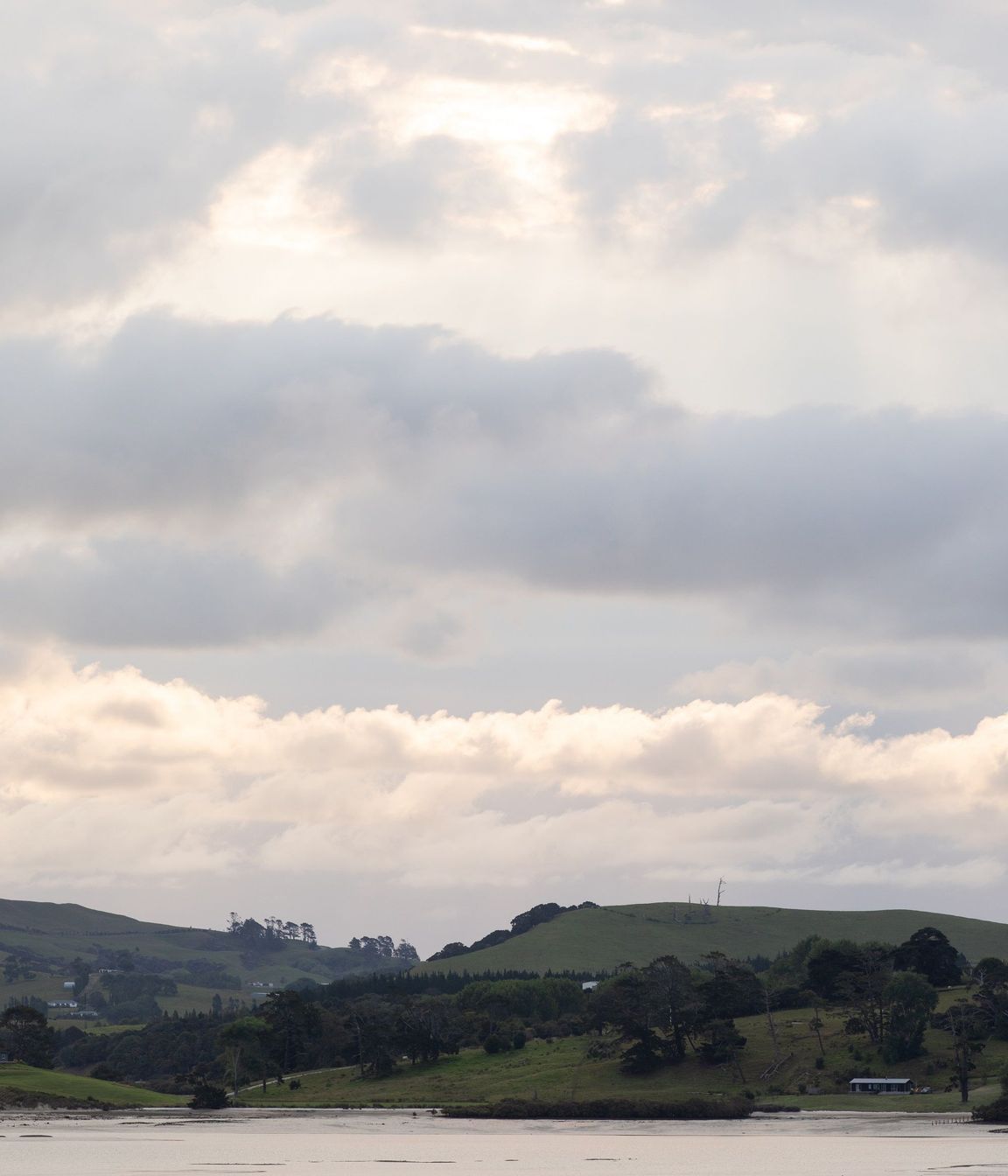The harbour and bush-clad hills create an idyllic setting. 