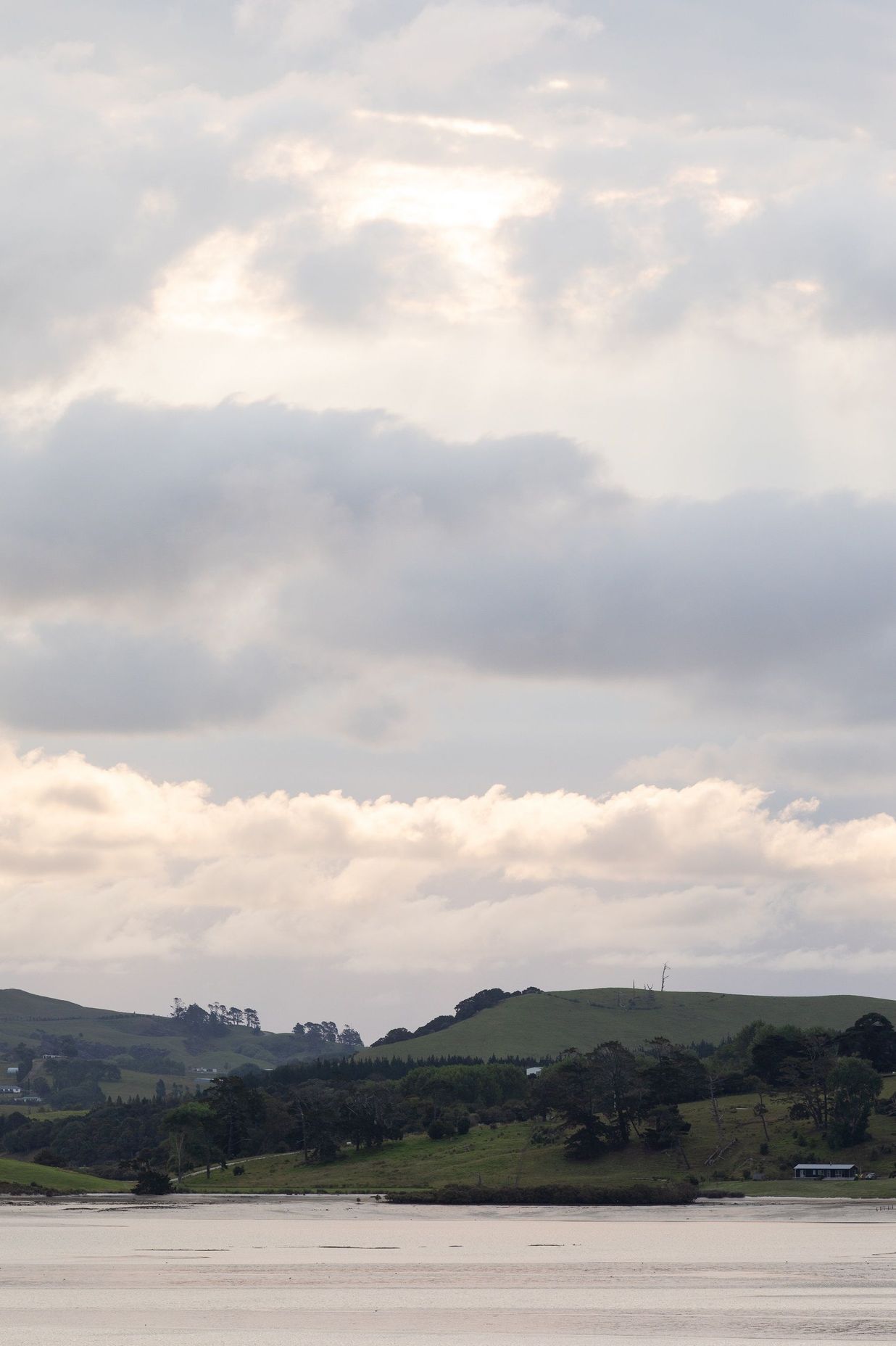 The harbour and bush-clad hills create an idyllic setting.