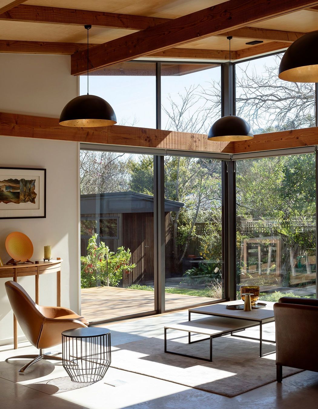 The key delineation between different areas of the house is defined by the ceilings that move from a low stud in the bedrooms, right through into the double-height glazing of the public areas