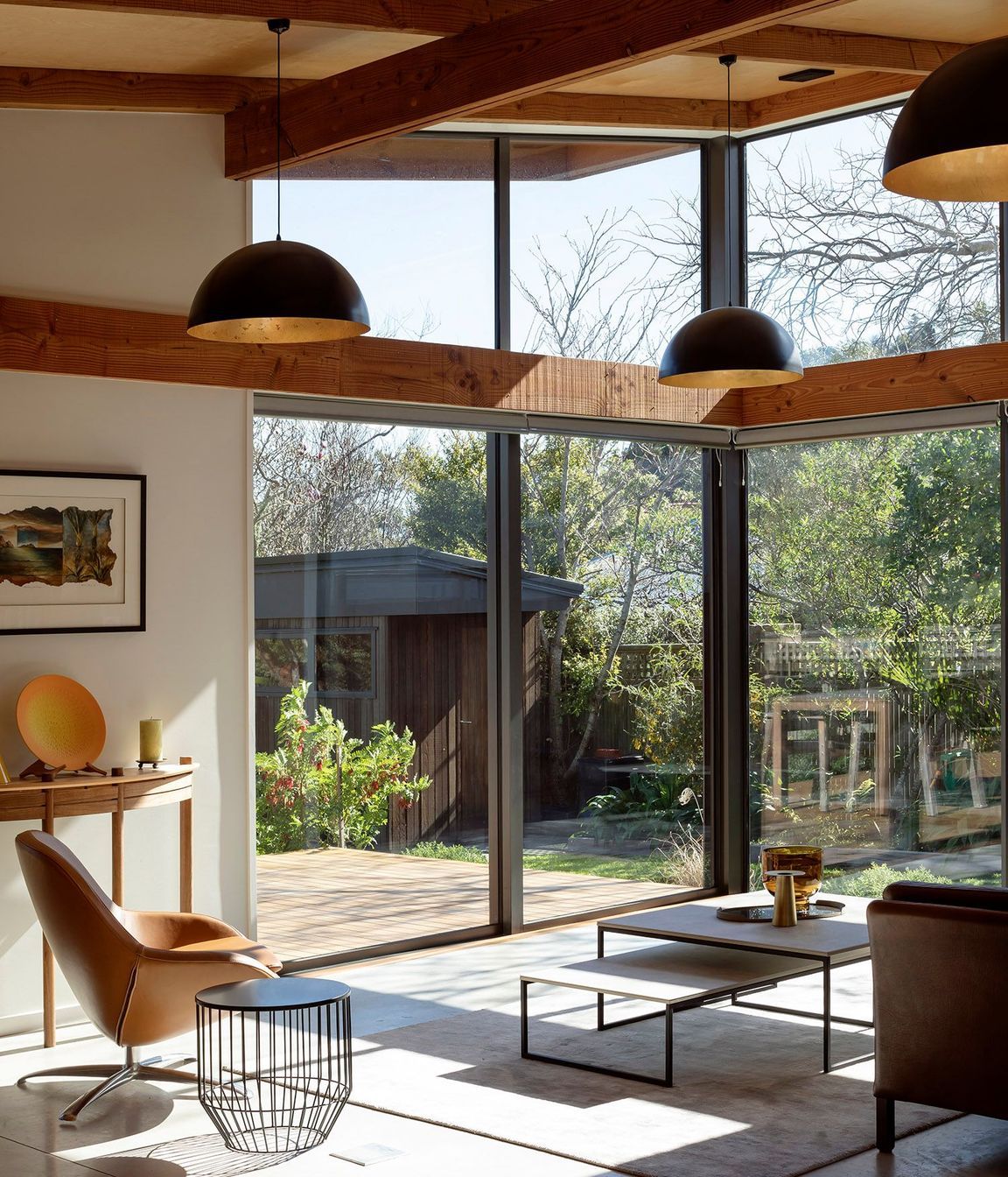 The key delineation between different areas of the house is defined by the ceilings that move from a low stud in the bedrooms, right through into the double-height glazing of the public areas