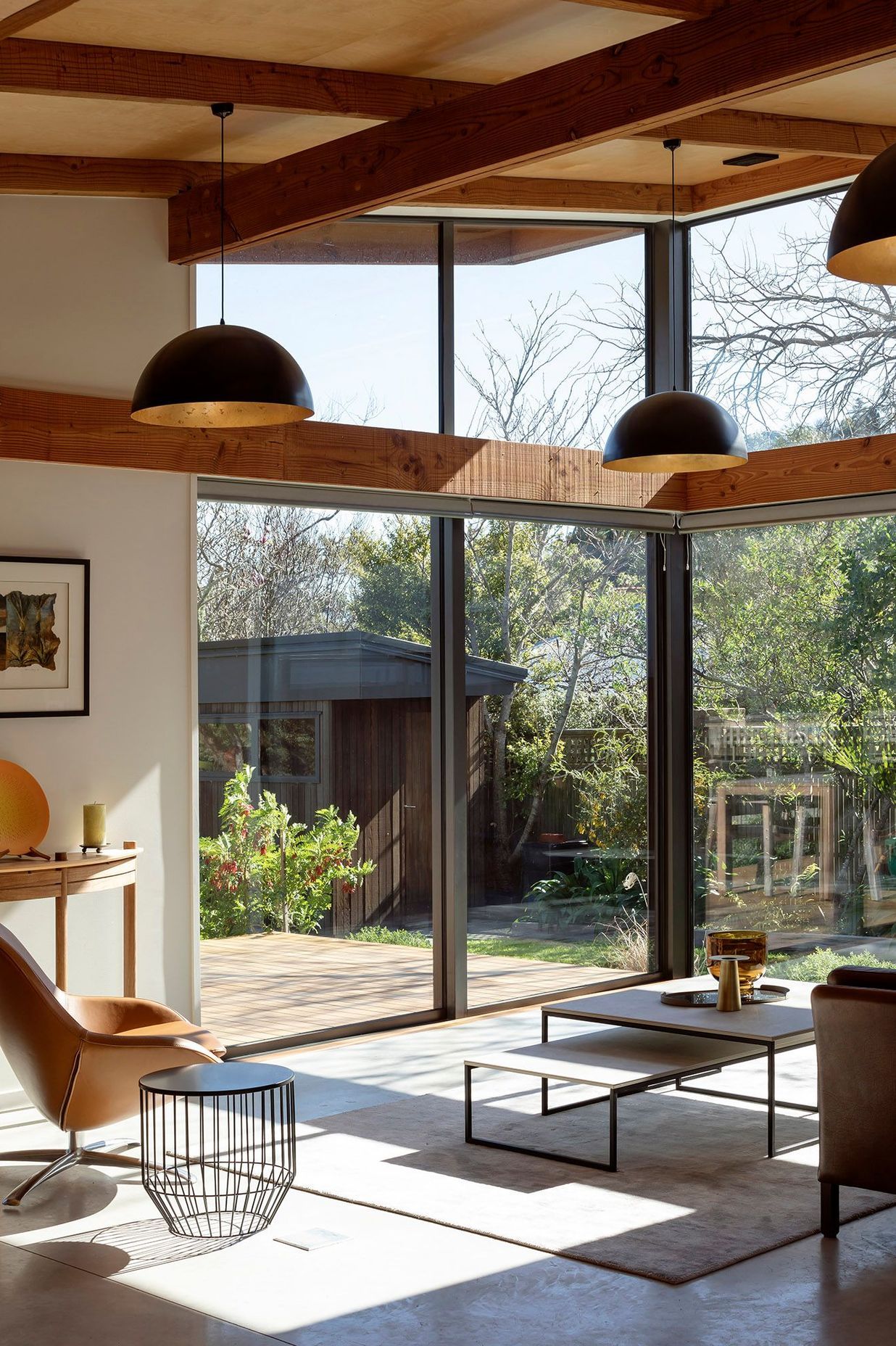 The key delineation between different areas of the house is defined by the ceilings that move from a low stud in the bedrooms, right through into the double-height glazing of the public areas