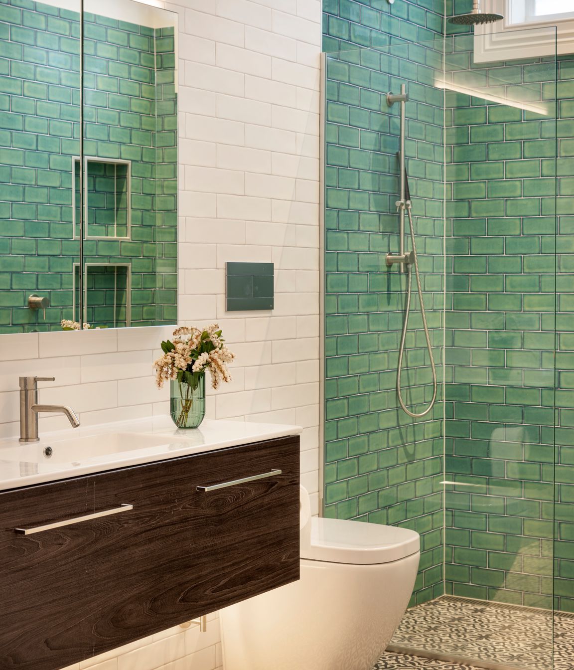 The ensuite bathroom features distinctive Victorian-style tiling on the walls and floor.