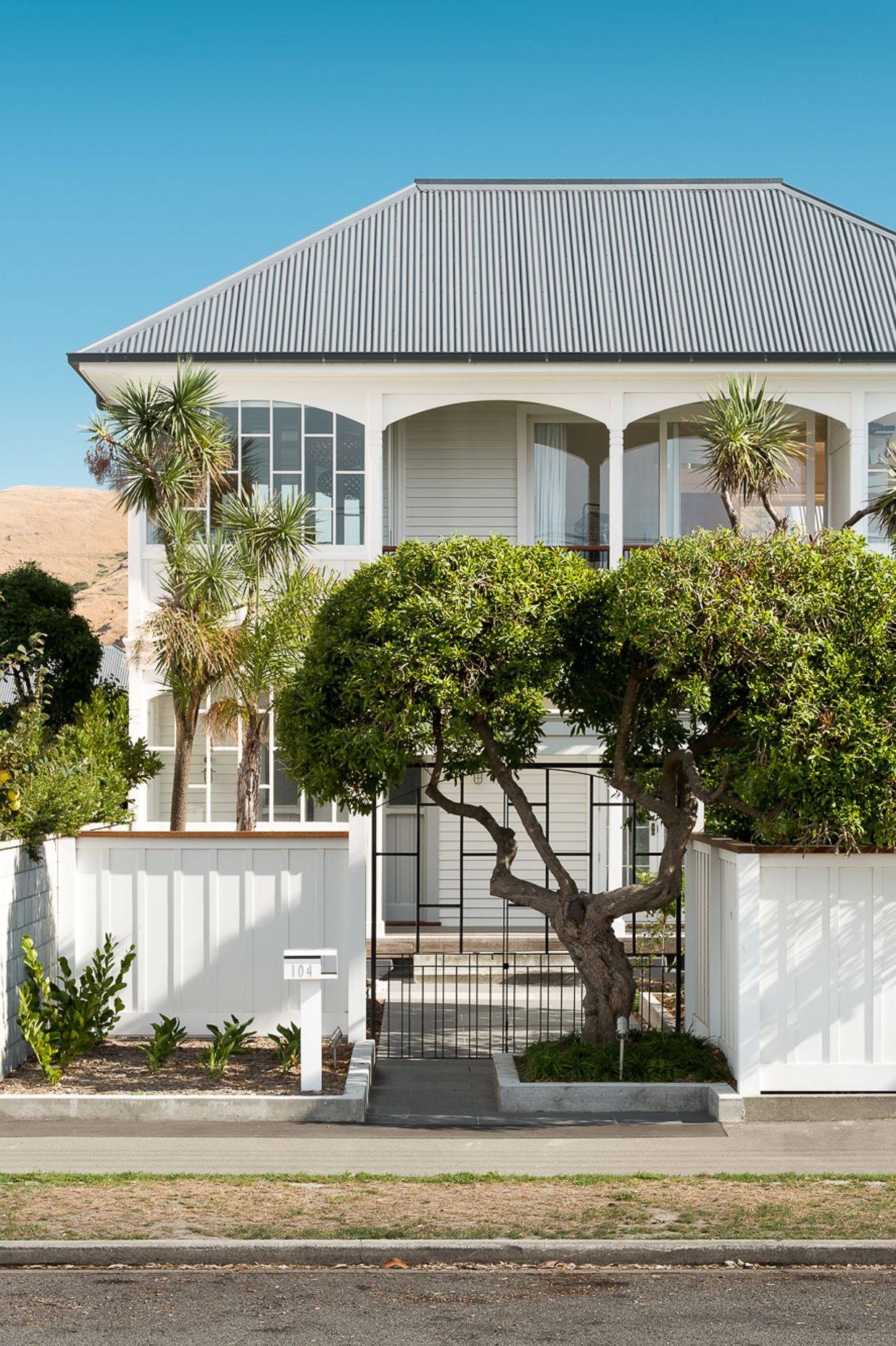 The front entry has been aligned with the front gate and an established tree.