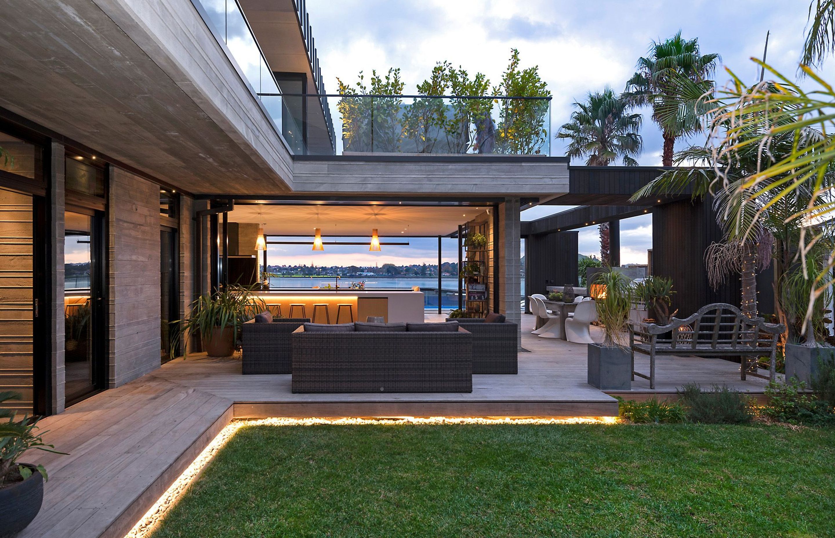 The view from the courtyard looks right across the kitchen to the water.