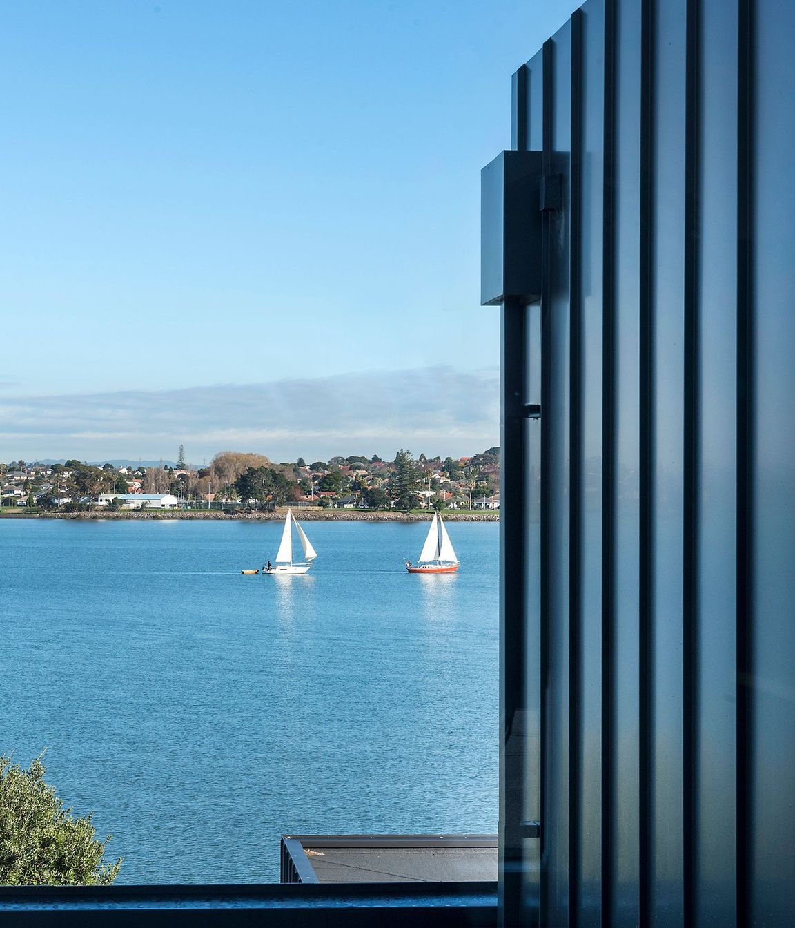 Watching the water and boats float by helps make this a remarkably peaceful home.