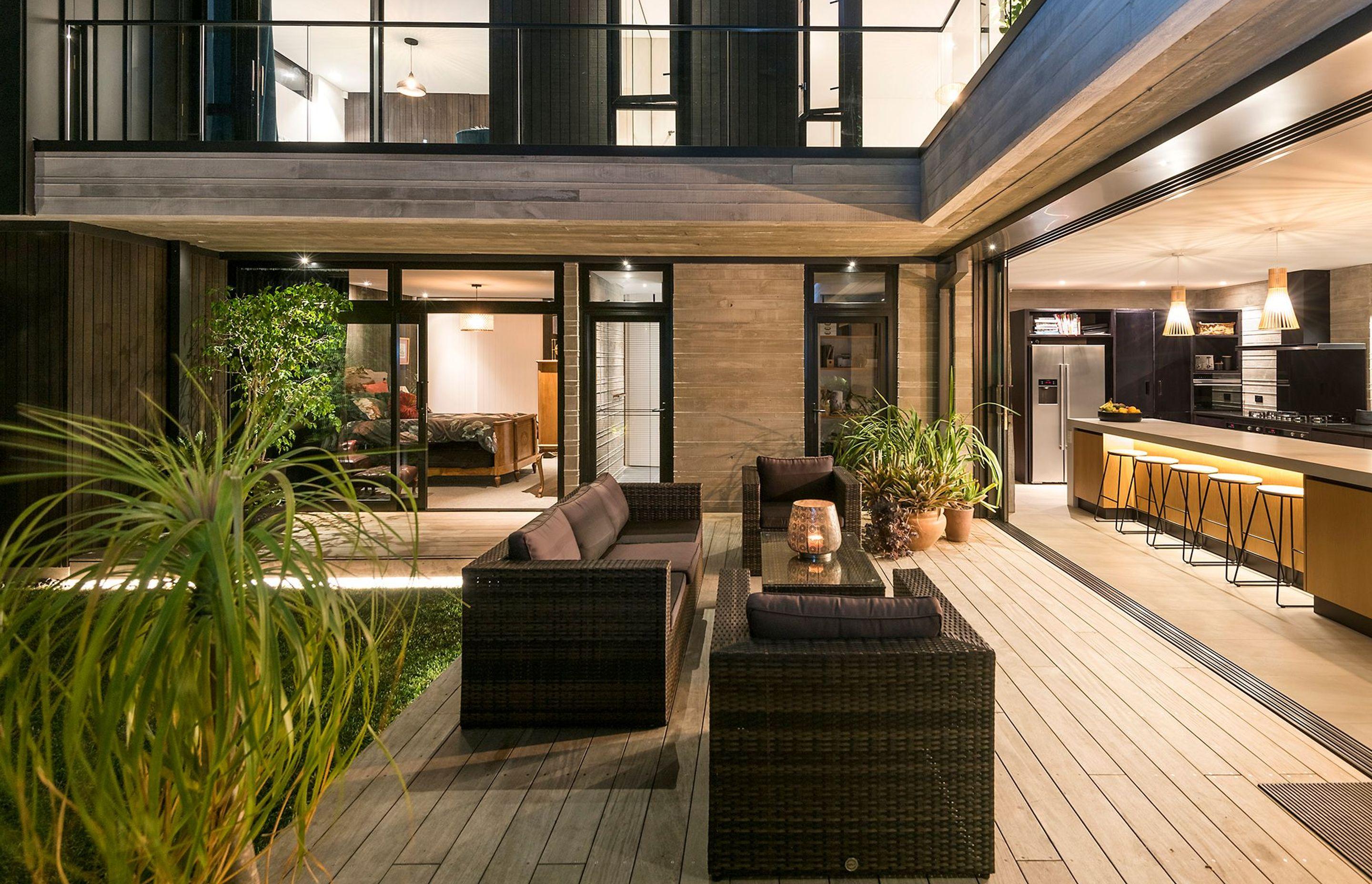 A sheltered courtyard provides the perfect lounge area for evening drinks, linking to both the kitchen, the scullery, and the guest bedroom and bathroom.
