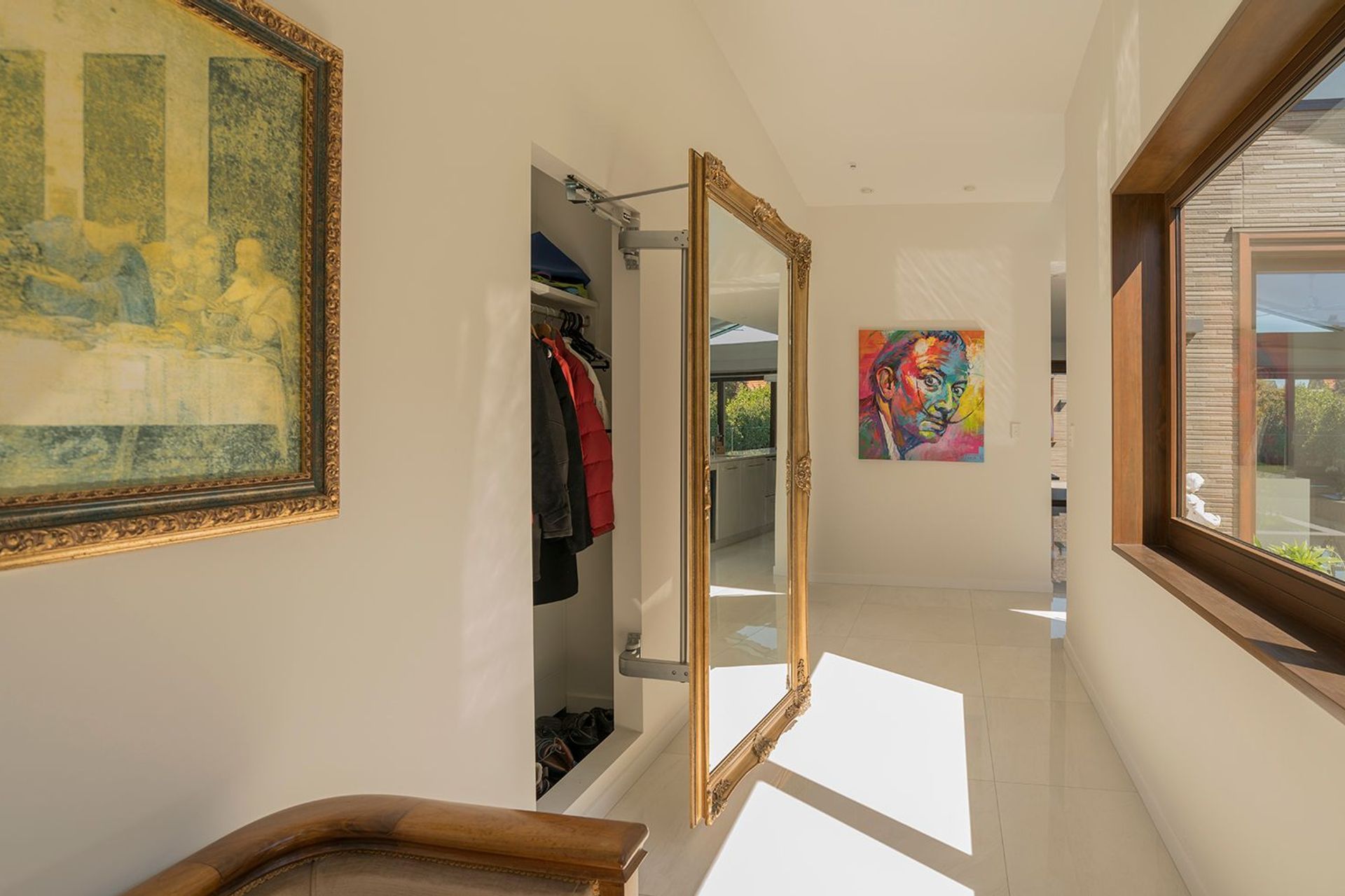 Mirror used for door to hidden hall wardrobe