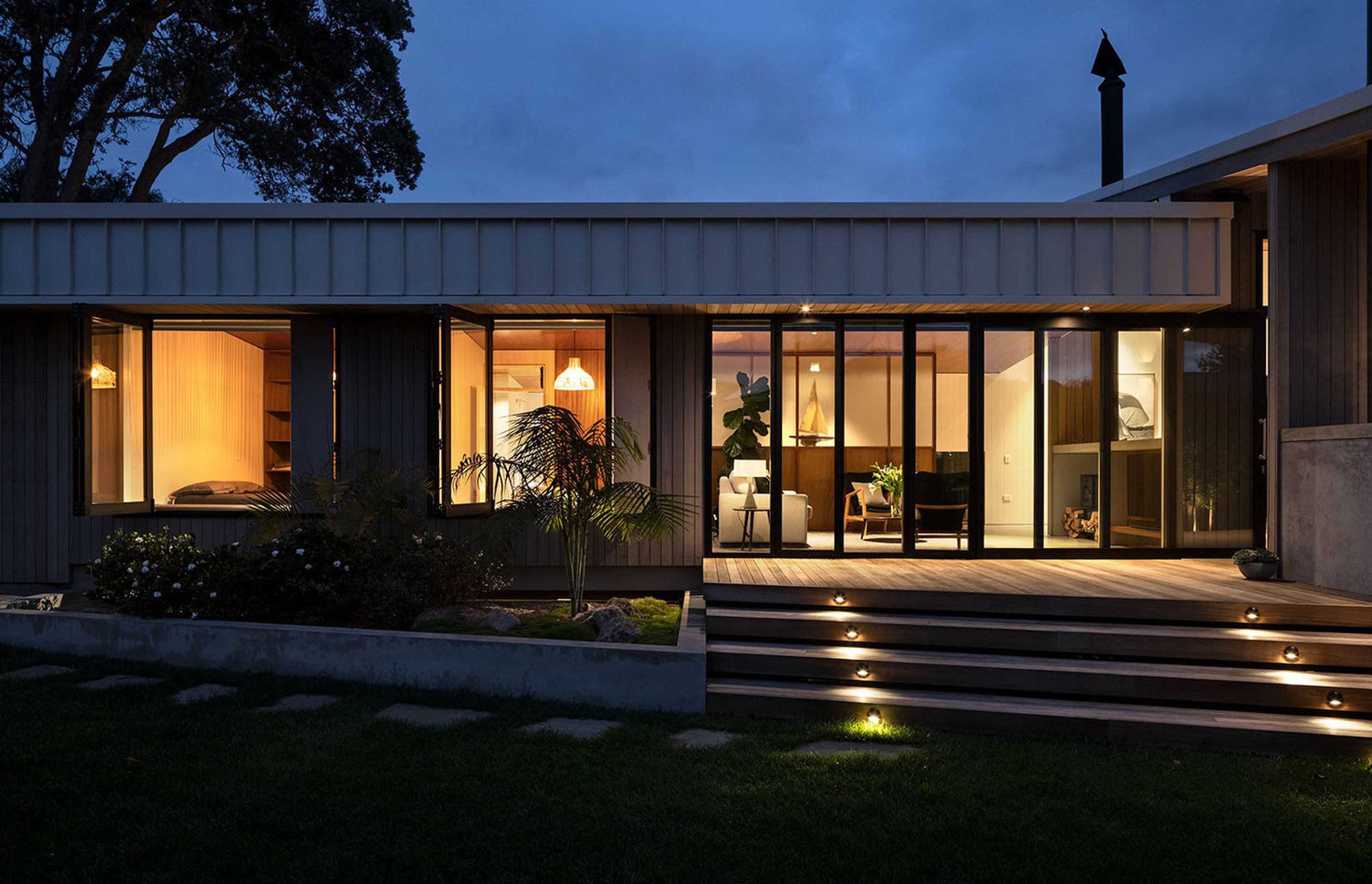 The main entrance leads from the driveway into the heart of the home – the open-plan living area and the outdoor entertaining area to the right.