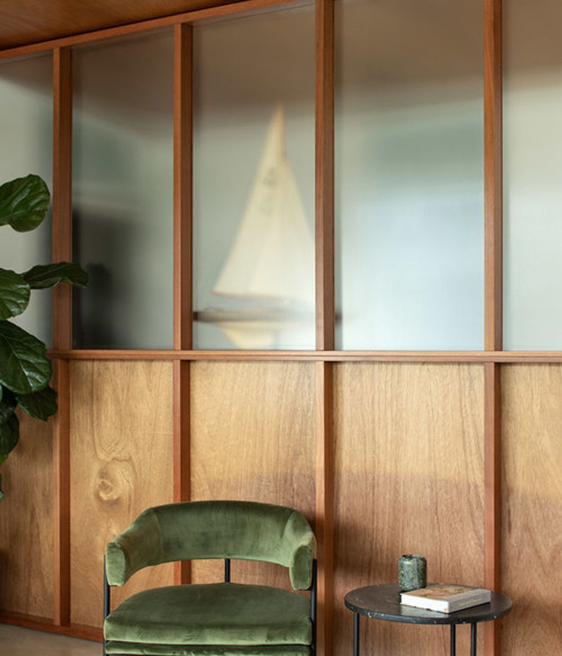 Timber panellng contrasts the white walls, adding warmth to the neutral colour scheme.