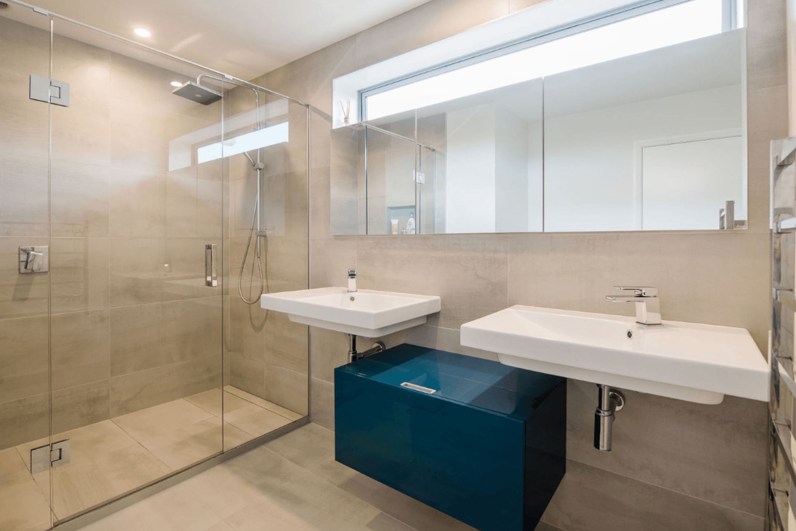 Master bedroom ensuite, custom recessed mirror cabinets over twin basins