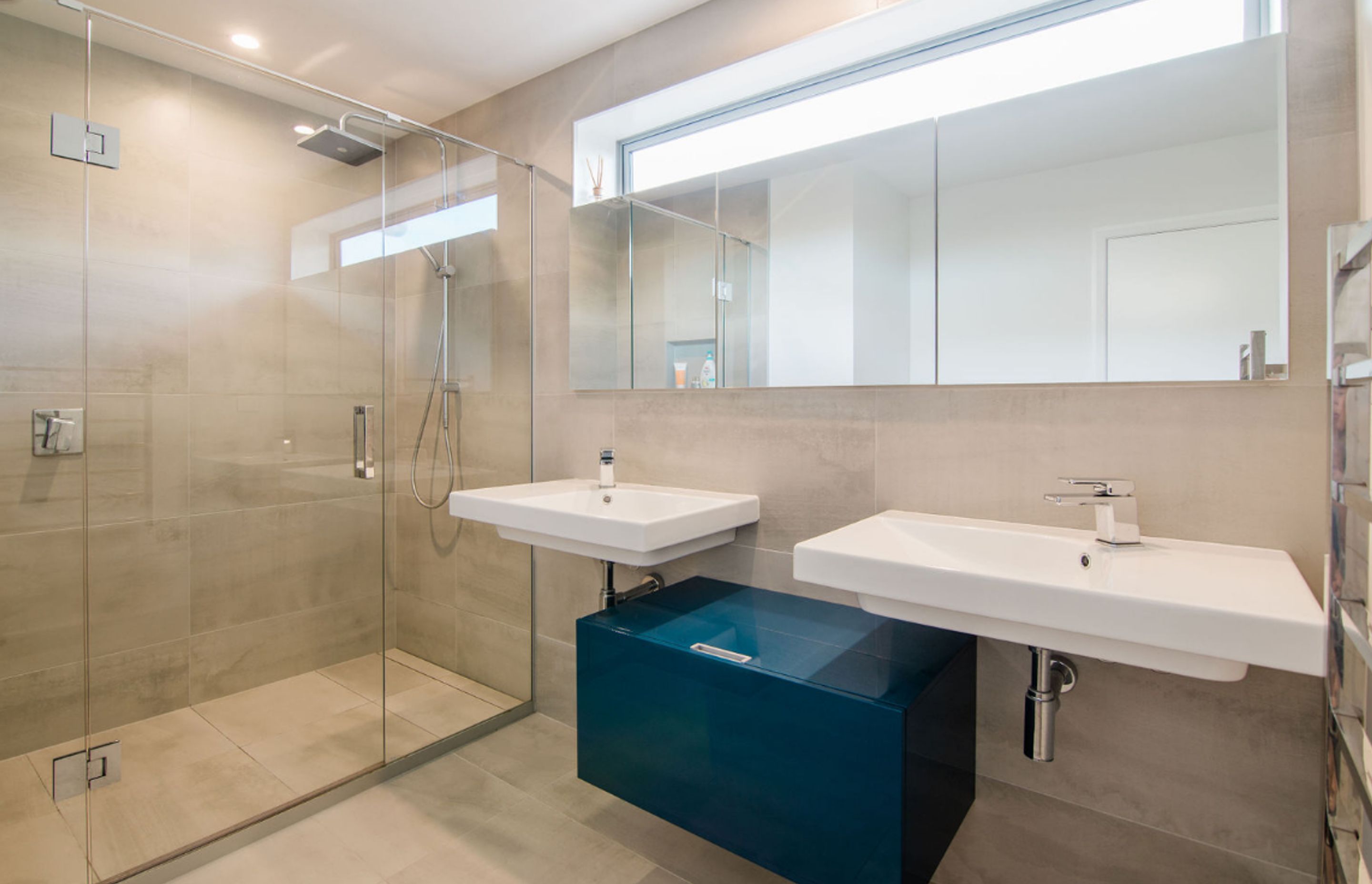 Master bedroom ensuite, custom recessed mirror cabinets over twin basins