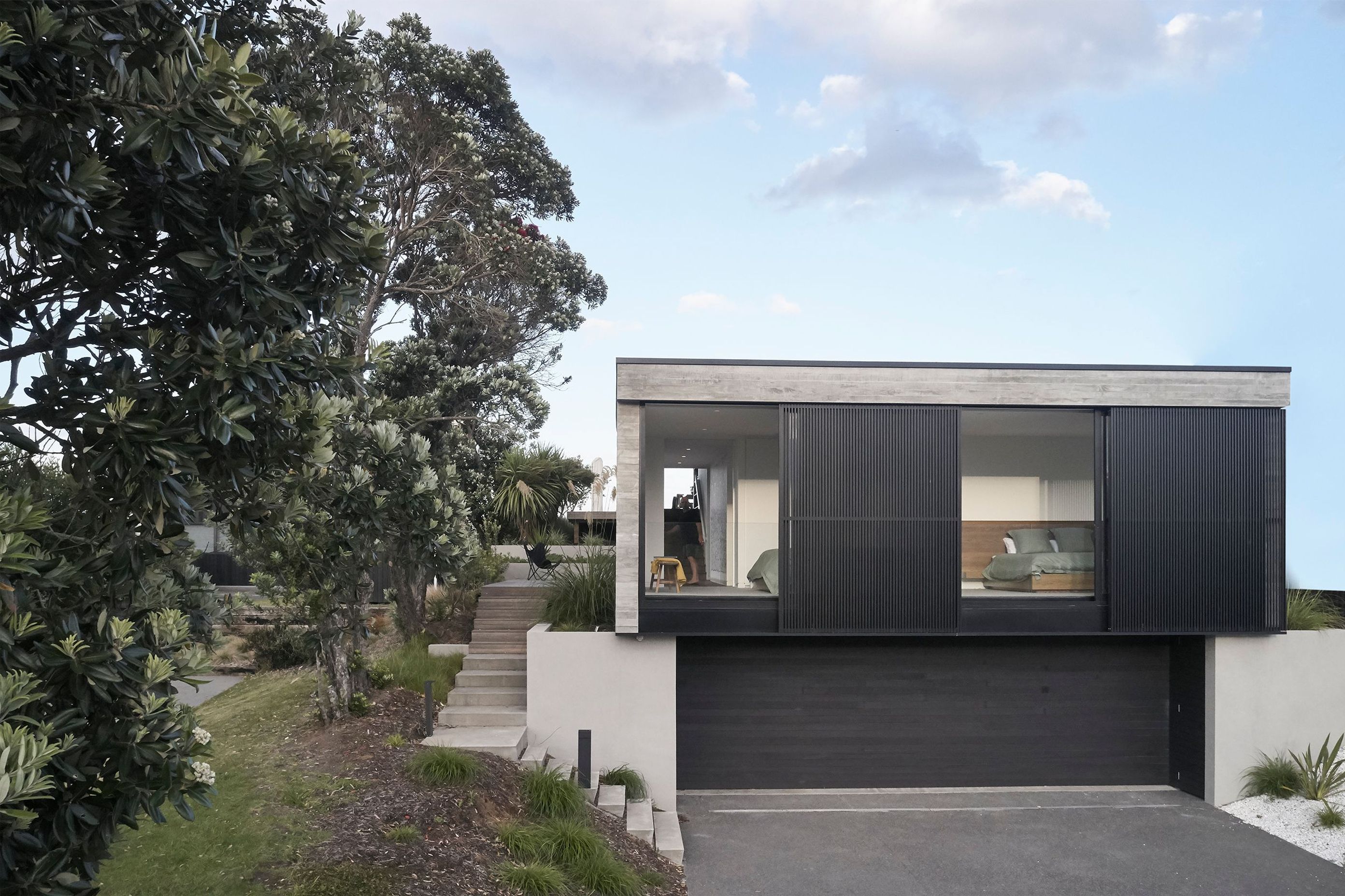 Approaching the garaging from the street, there is a sense that this level was built into the sloping slight rather than dominating it. 