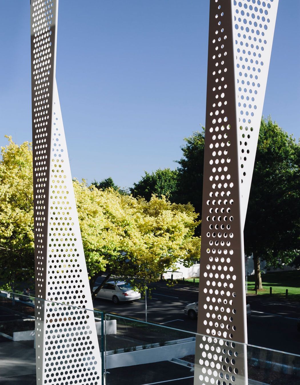 Facing west, towards the Green Frame, the end of the building features perforated screens designed to mitigate solar gain.