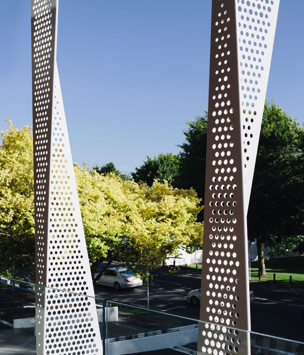 Facing west, towards the Green Frame, the end of the building features perforated screens designed to mitigate solar gain.