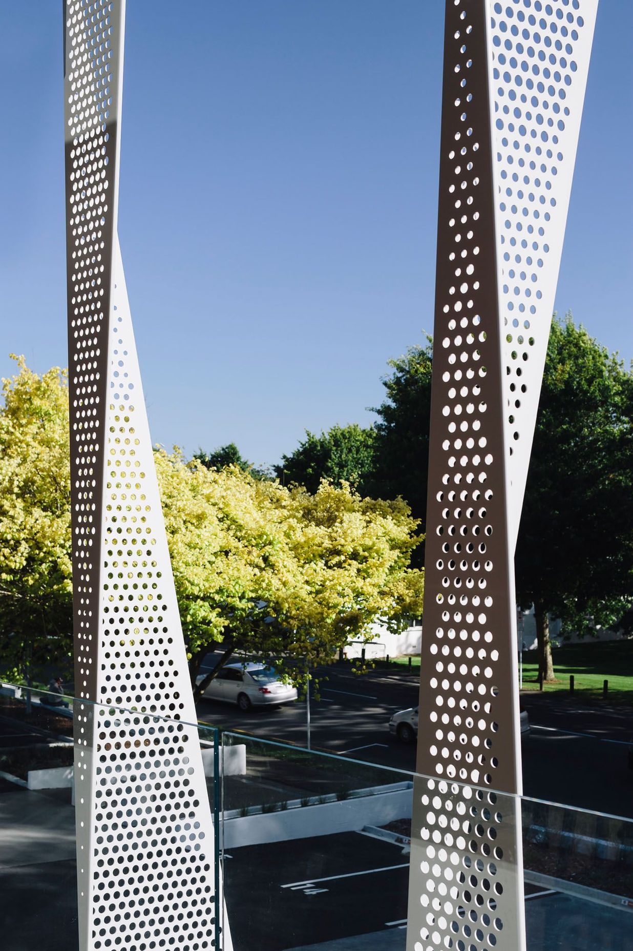 Facing west, towards the Green Frame, the end of the building features perforated screens designed to mitigate solar gain.