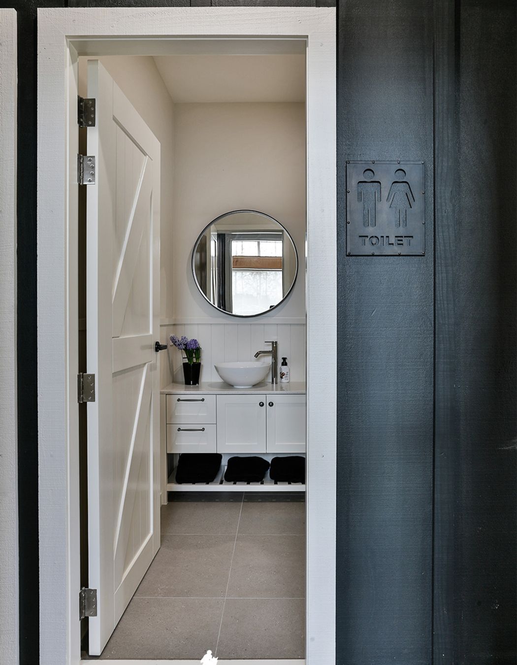 The downstairs bathroom services the garage, dance studio and stables.