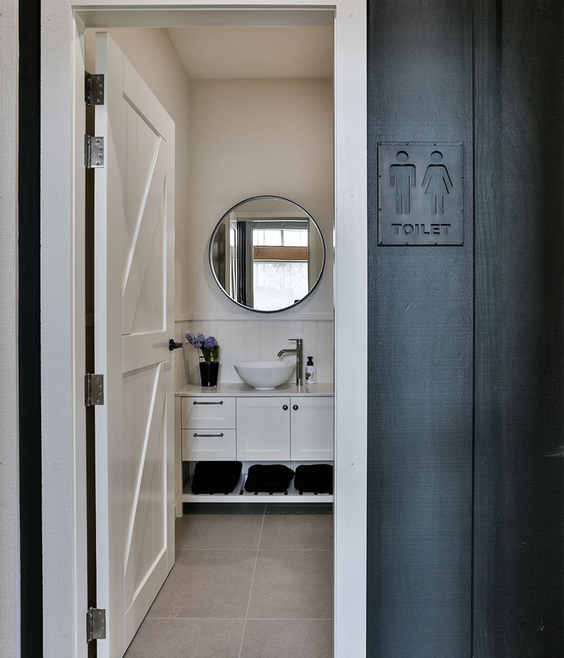The downstairs bathroom services the garage, dance studio and stables.
