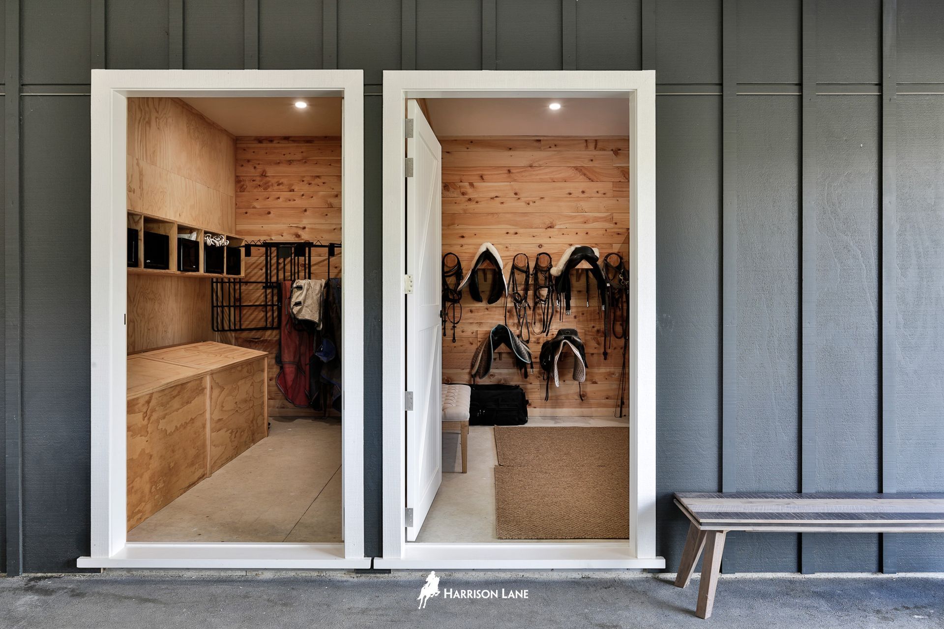On the left is the feed room, which has six built-in feed bins for rodent-proof storage of horse feed, shelving and racks for hanging rugs, and, on the right, is the the tack room.