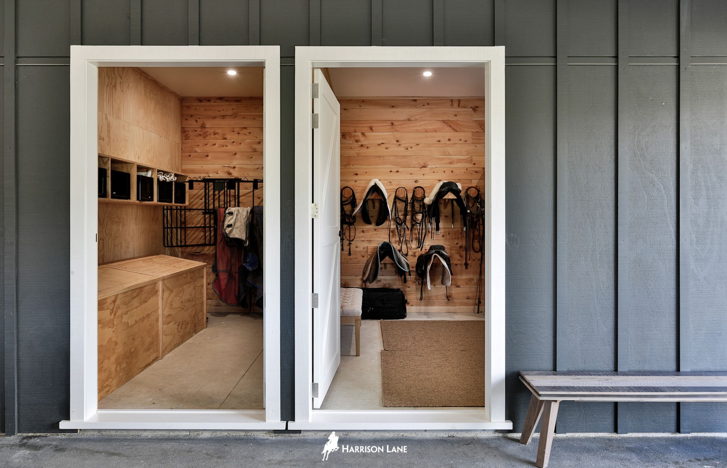 On the left is the feed room, which has six built-in feed bins for rodent-proof storage of horse feed, shelving and racks for hanging rugs, and, on the right, is the the tack room.