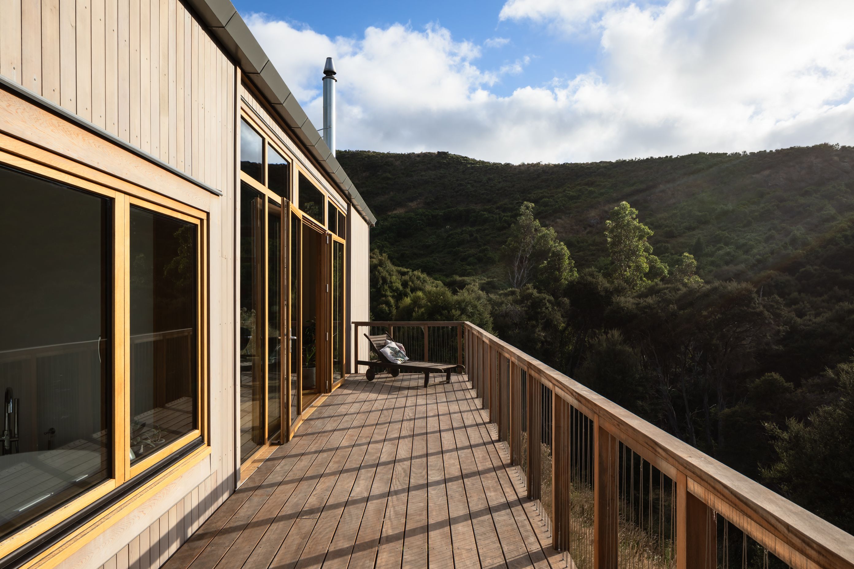 The suspended balcony takes in the panoramic view as it extends down the length of the building.